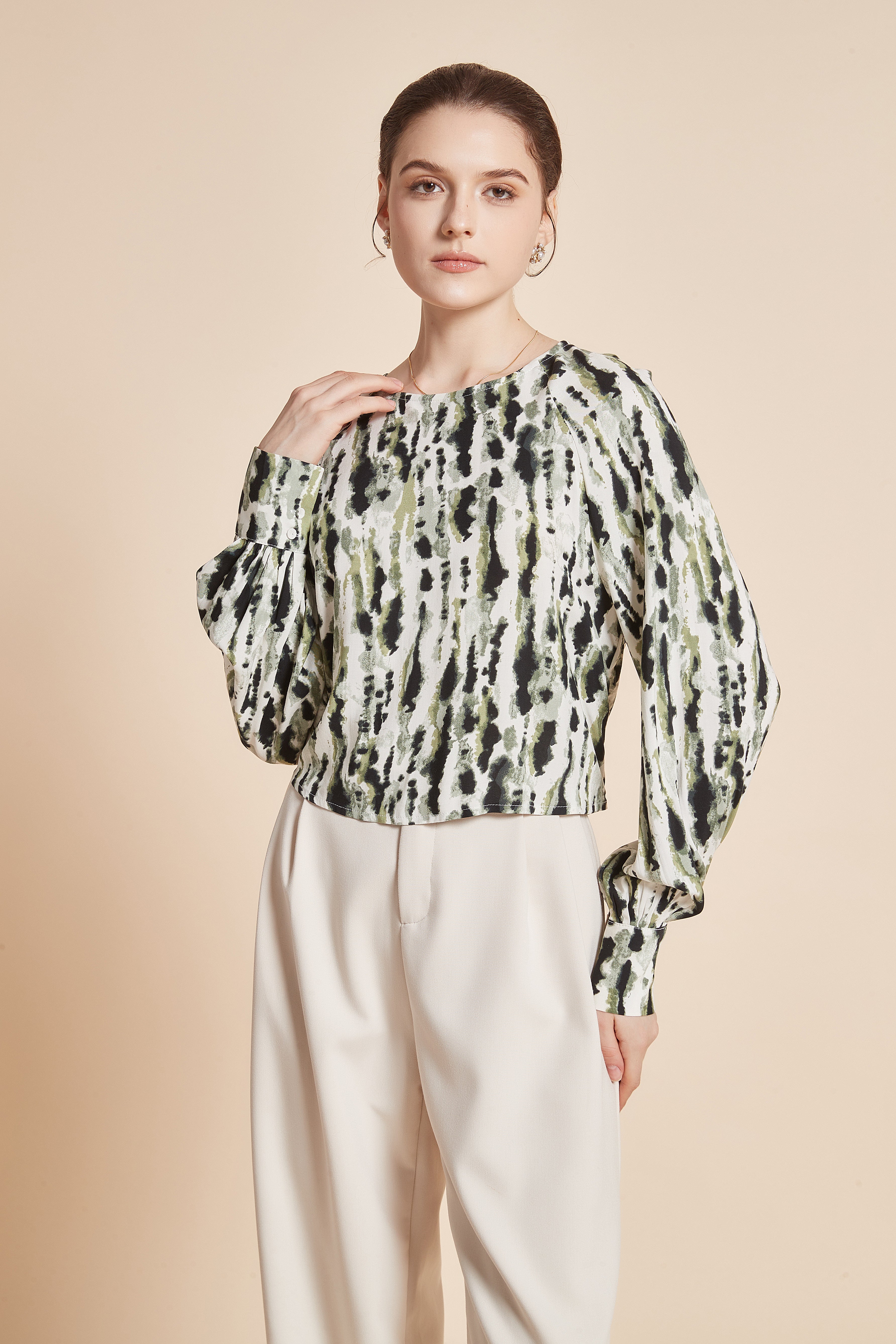 Striped blouse with vertical colors, long wide sleeves, and a round neckline