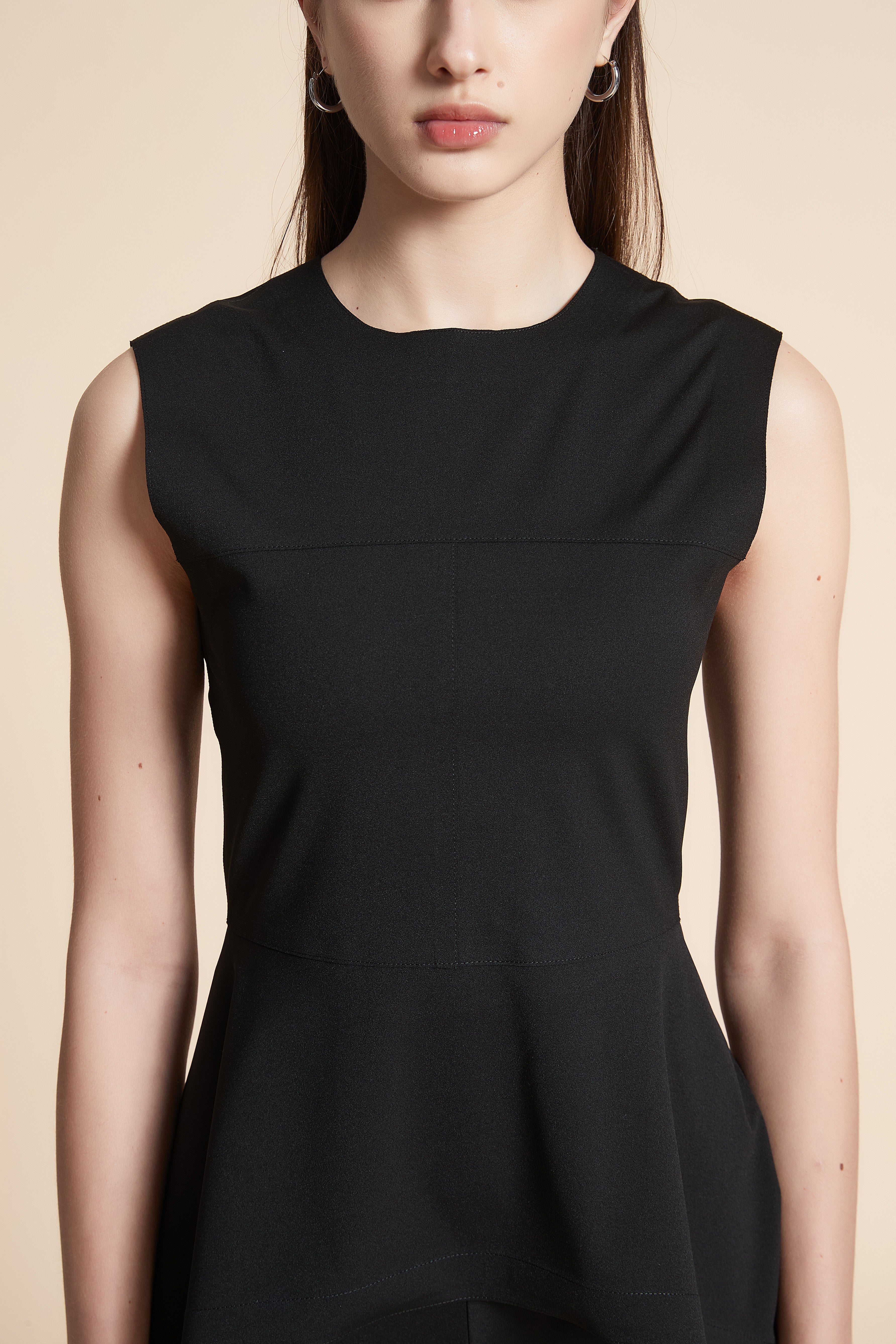 Solid Sleeveless Mid-Length Blouse