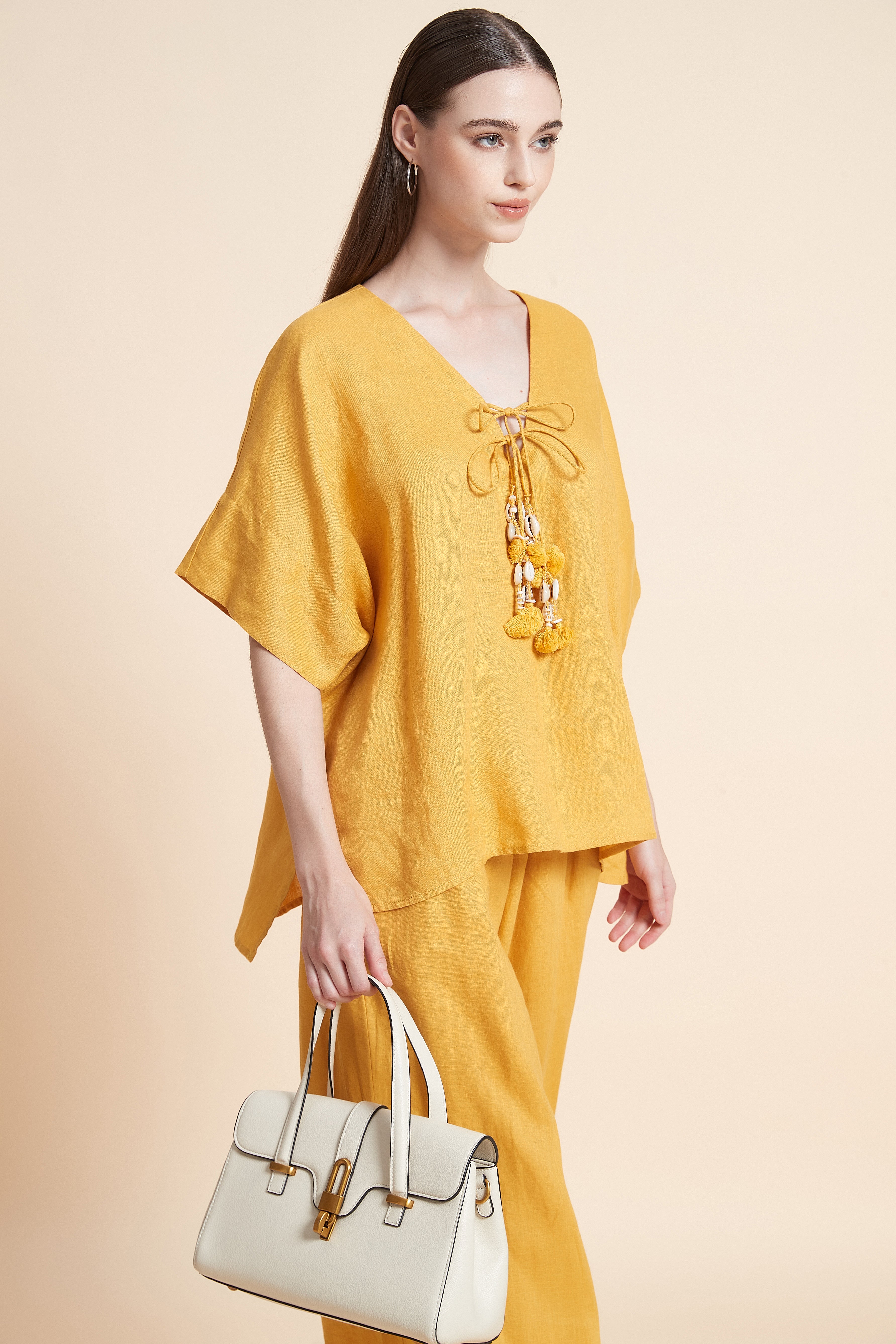 Linen blouse with tassel details