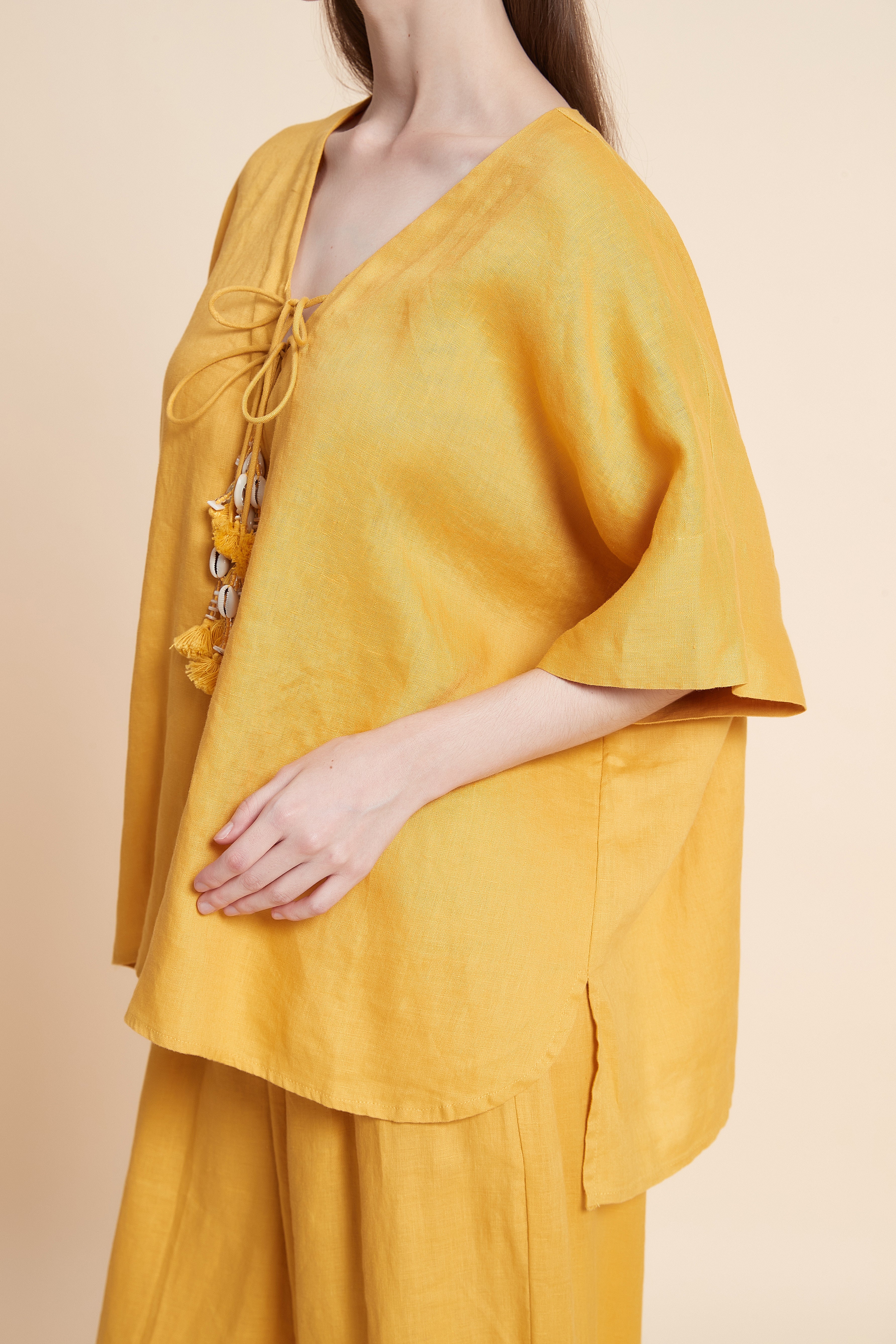 Linen blouse with tassel details