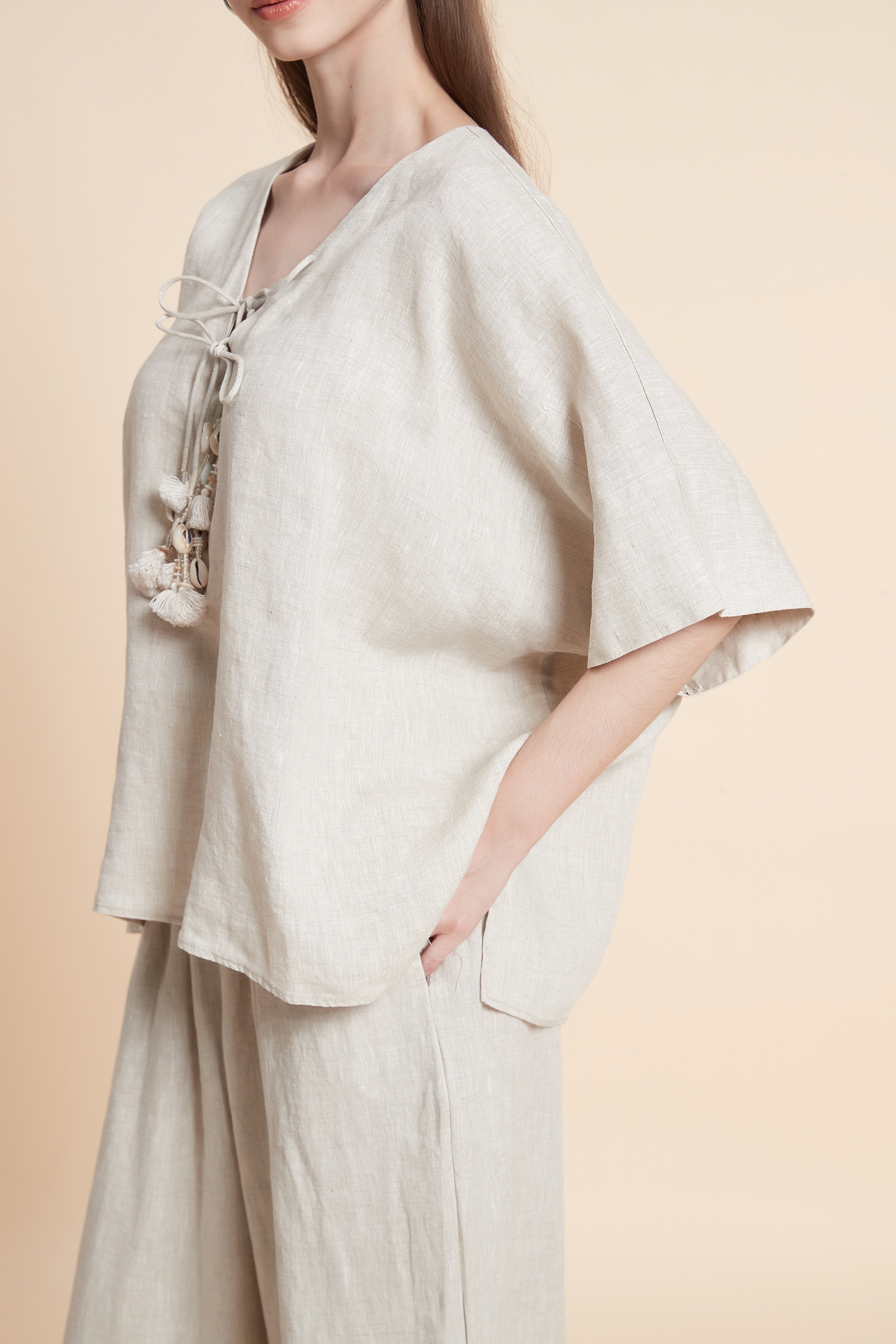 Linen blouse with tassel details