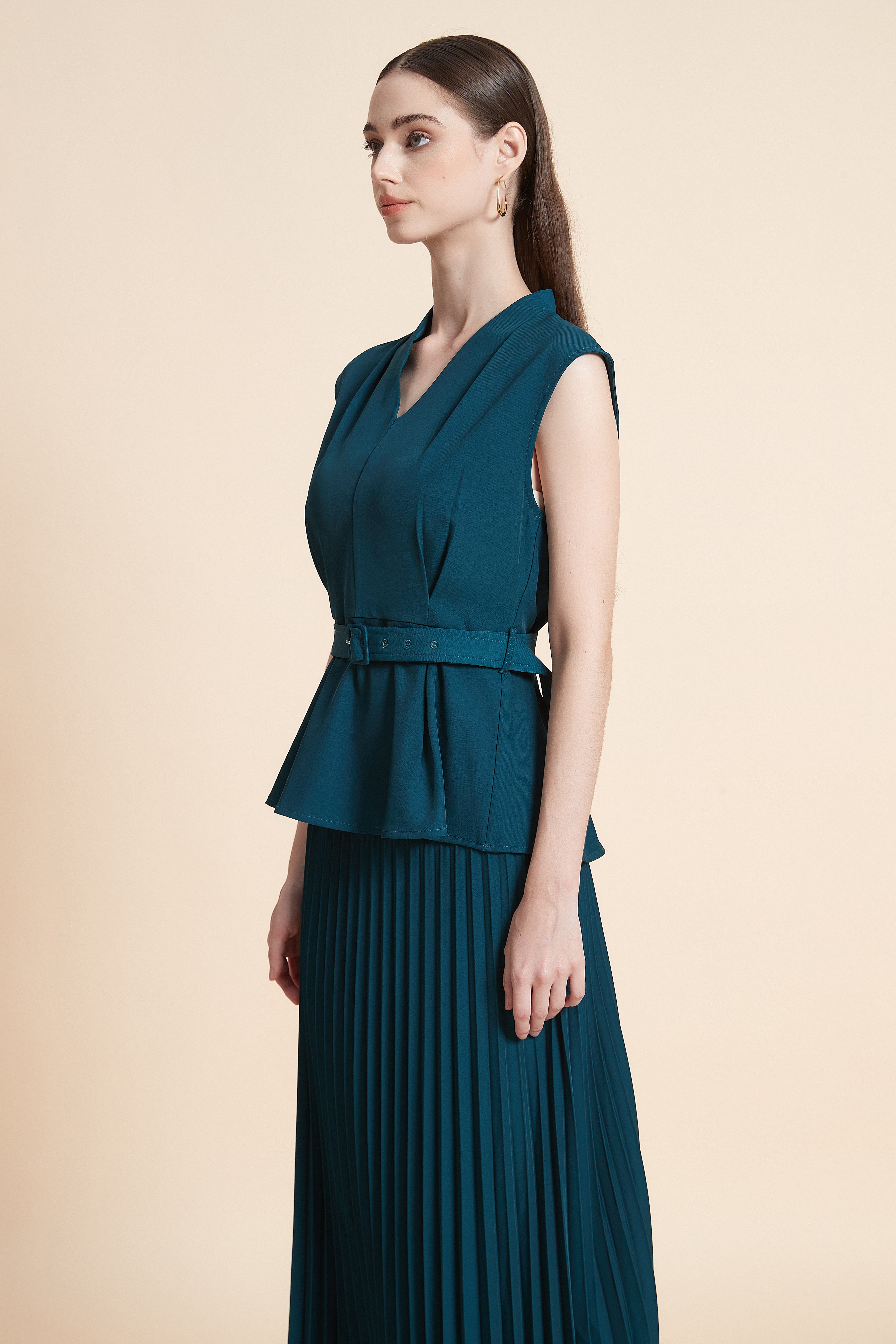Sleeveless peplum top with a belt