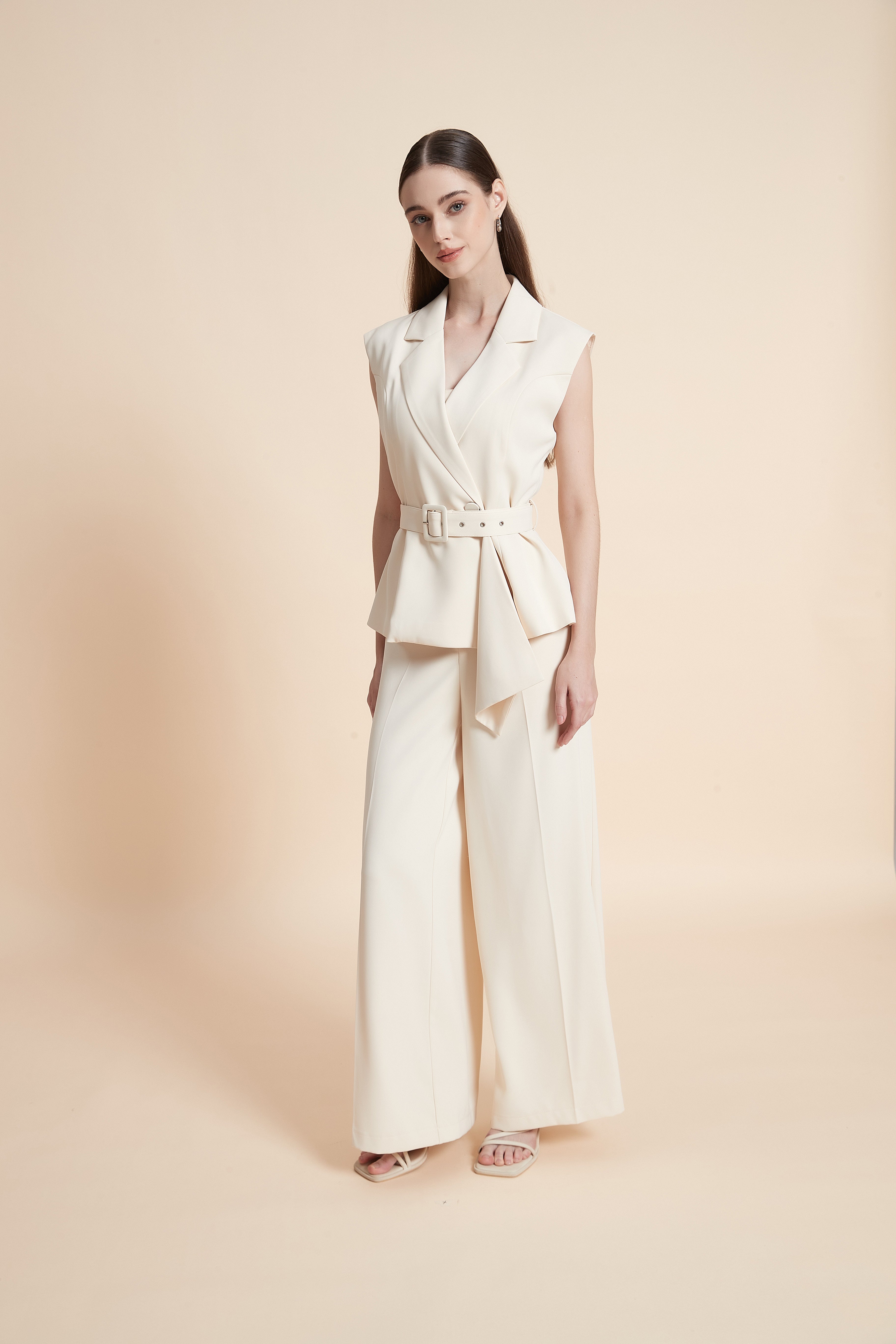 Tailored sleeveless vest with a belt
