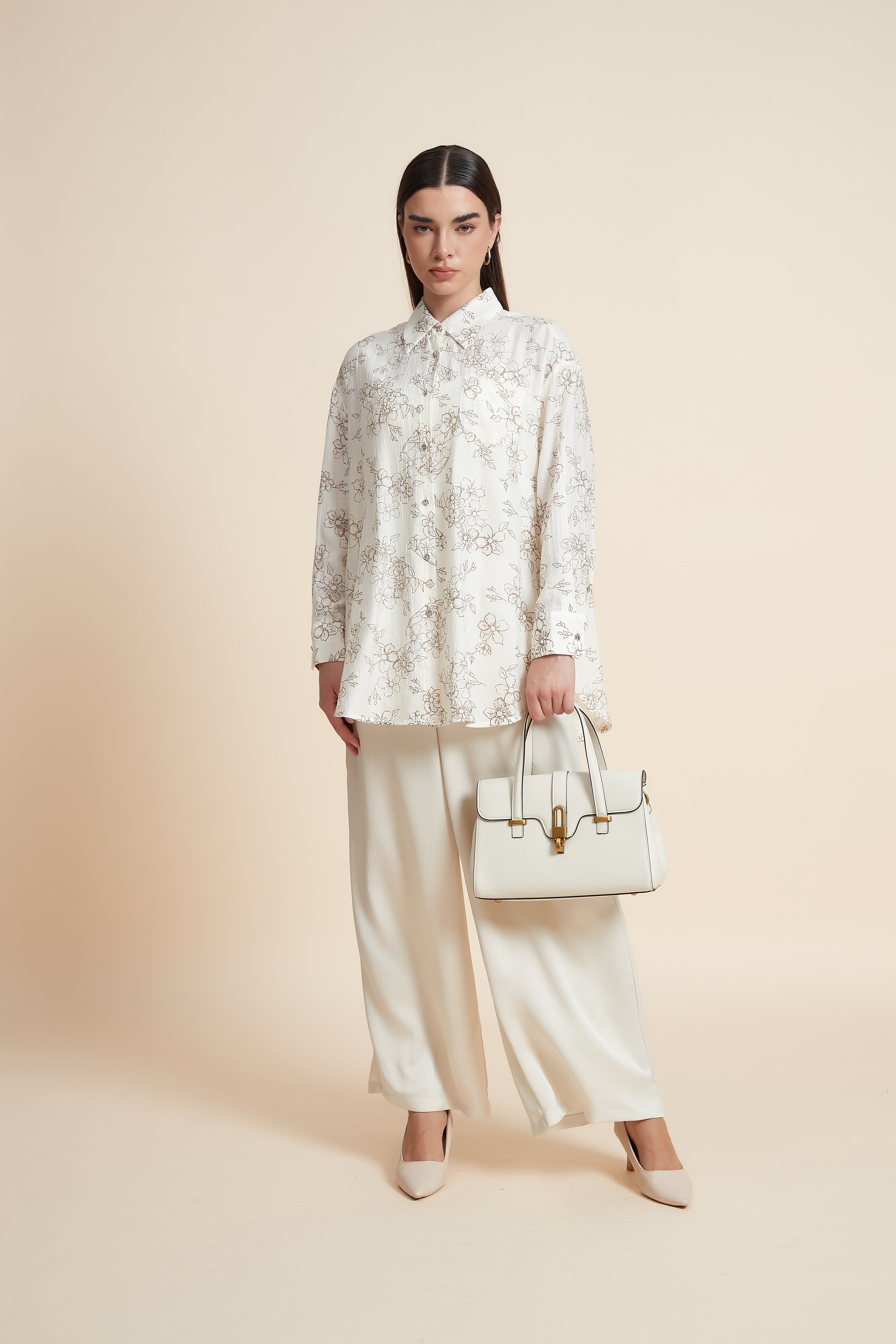 بلوزة منقوشة بكم طويل وياقة قميص