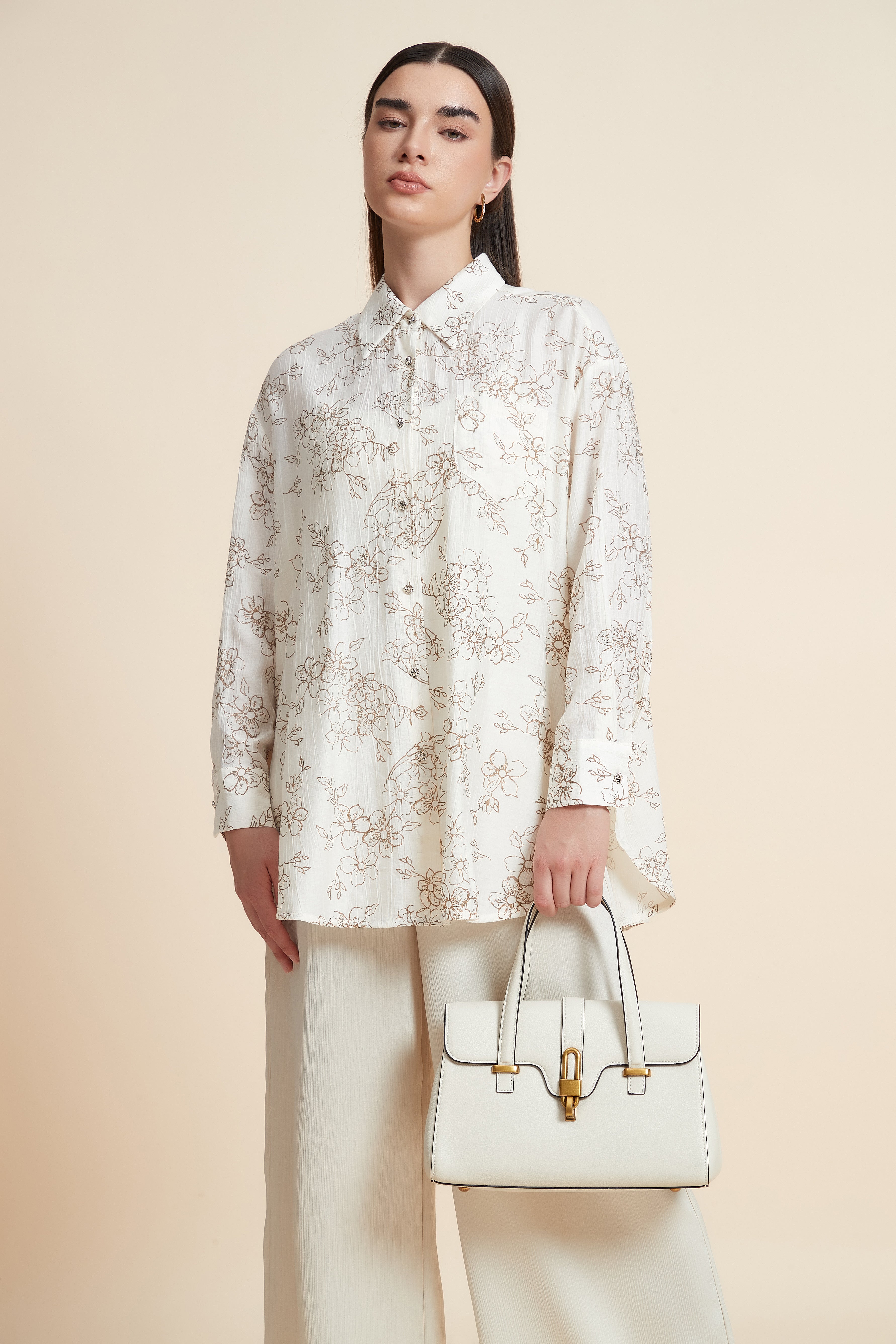 بلوزة منقوشة بكم طويل وياقة قميص