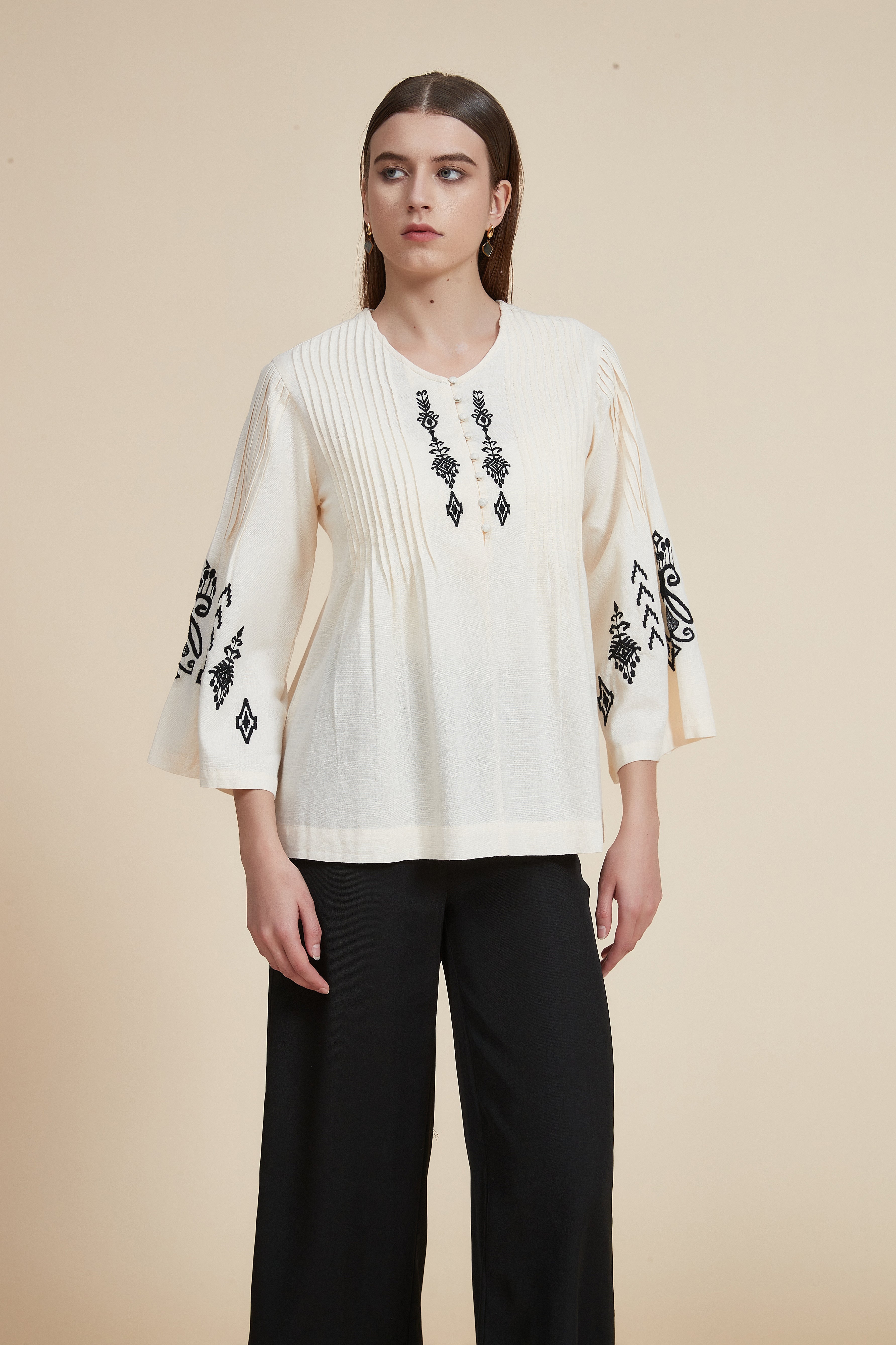 Pleated blouse with wide sleeves