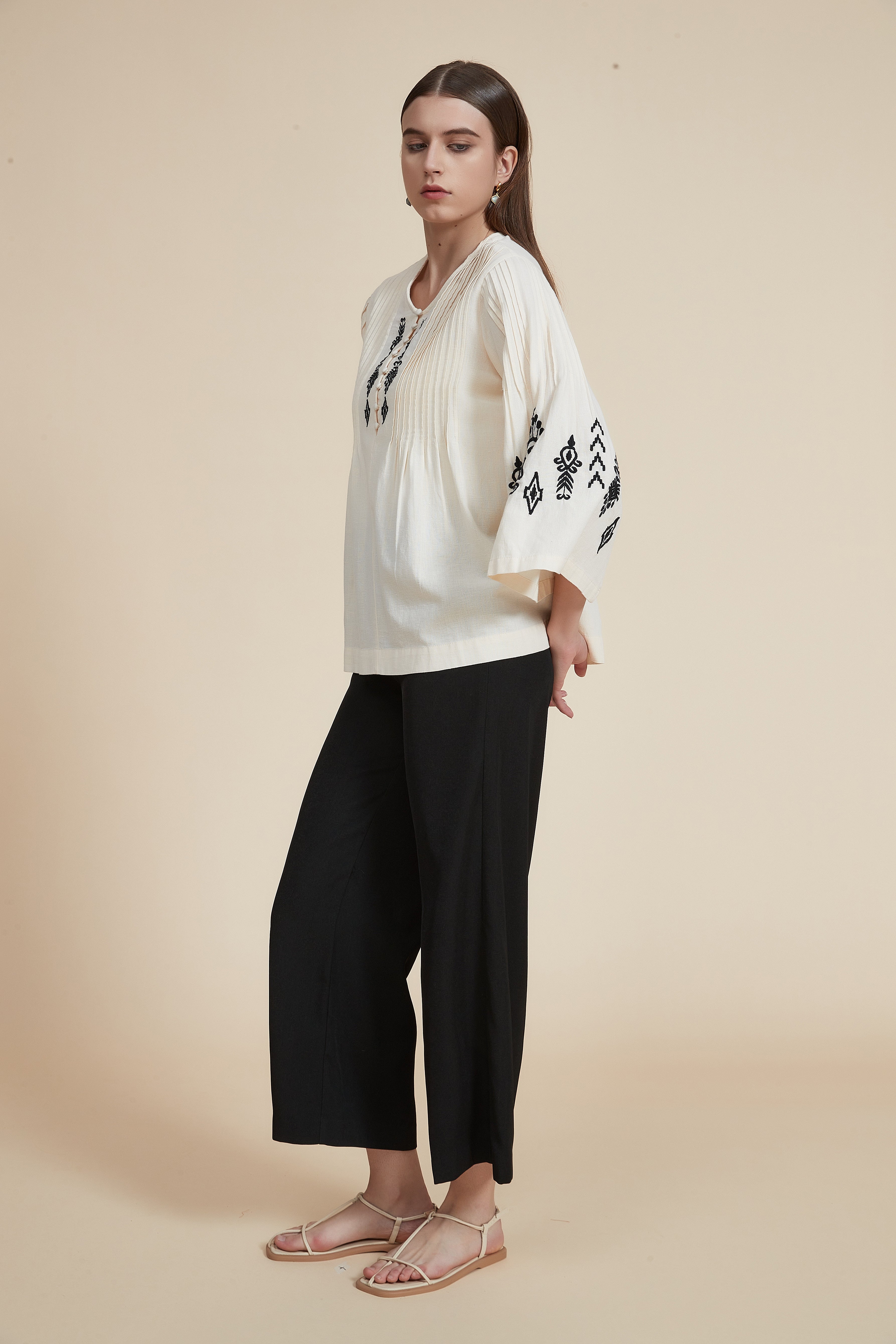 Pleated blouse with wide sleeves