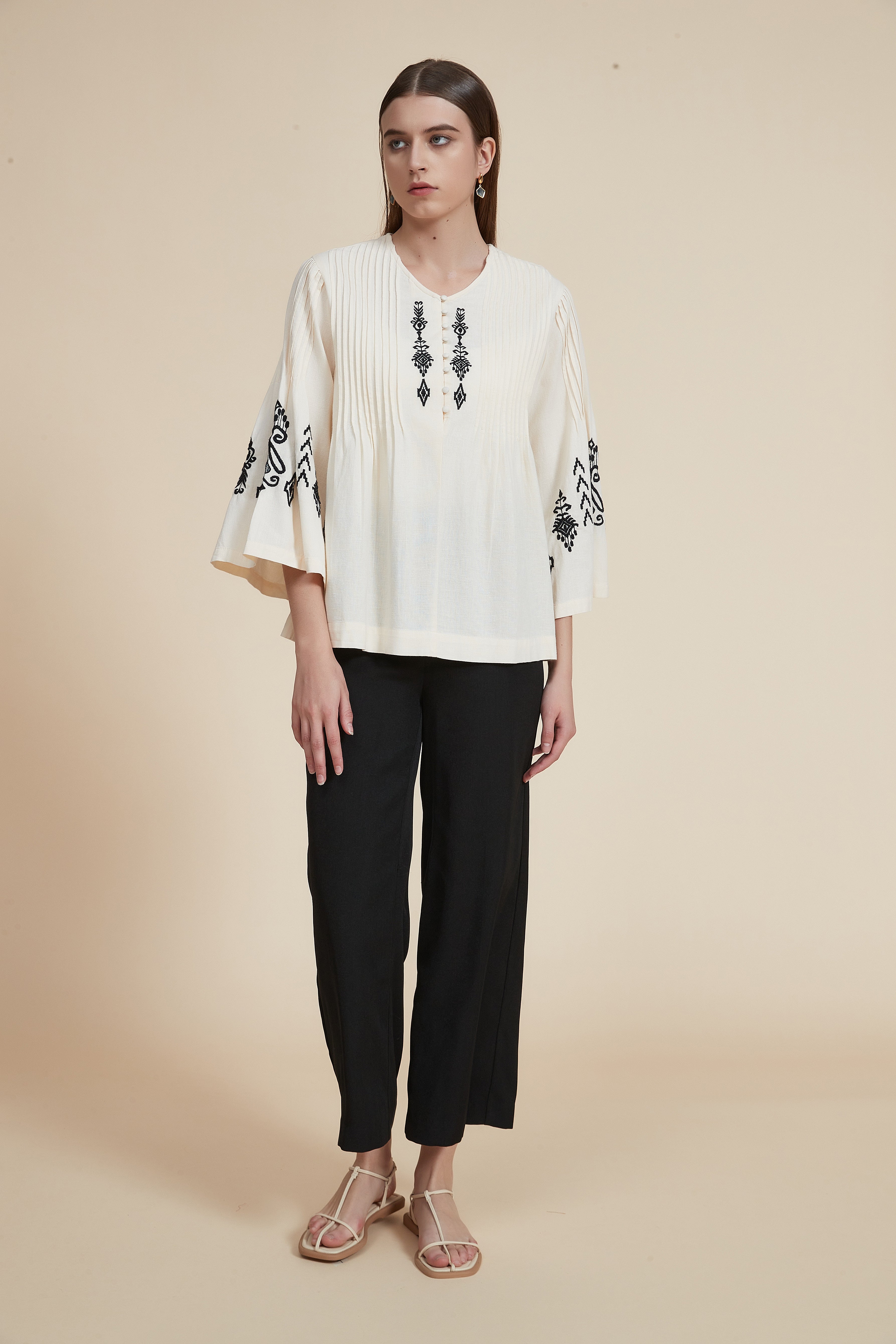Pleated blouse with wide sleeves
