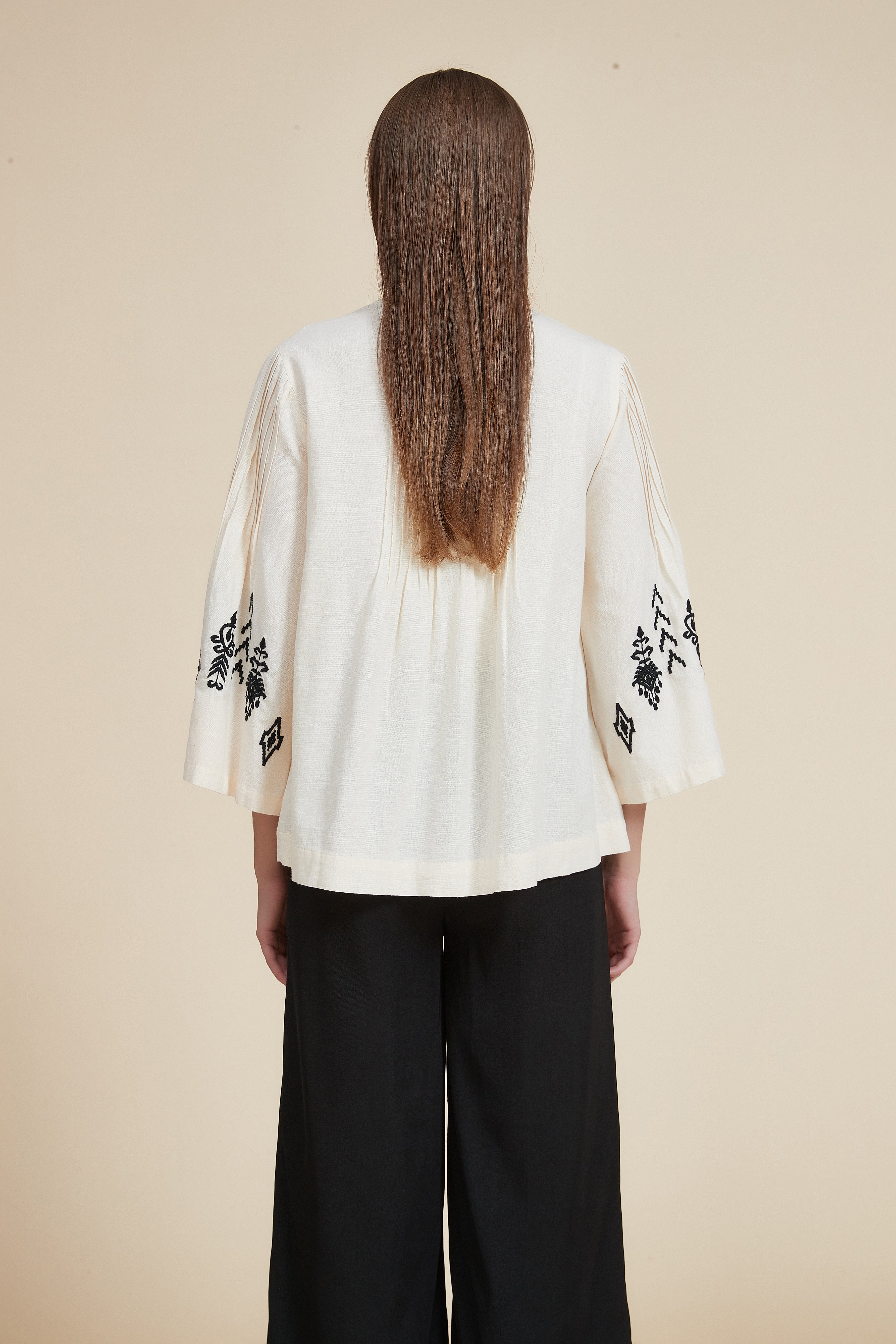 Pleated blouse with wide sleeves