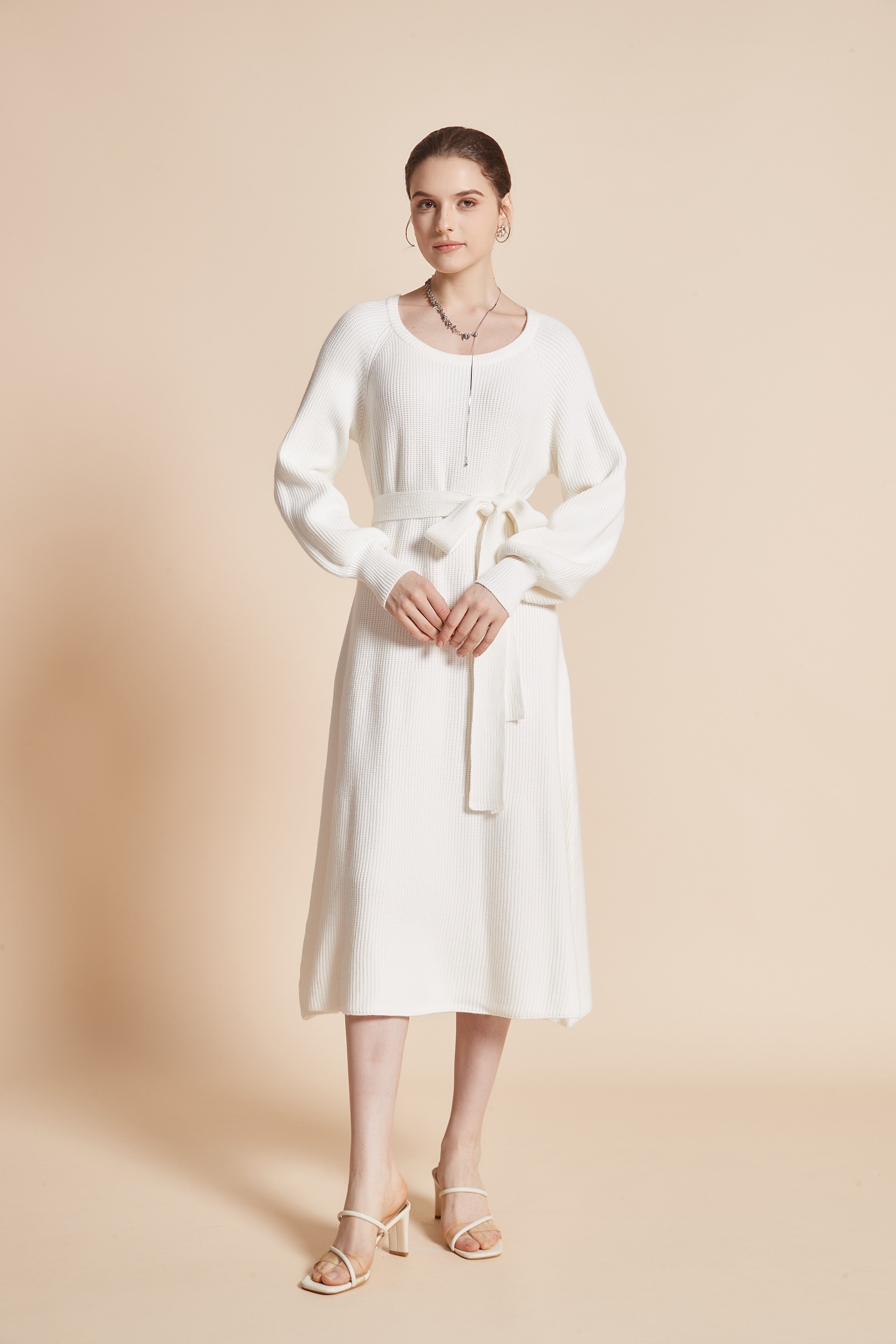 Yola Midi dress with a round neckline, long wide sleeves, and a waist tie