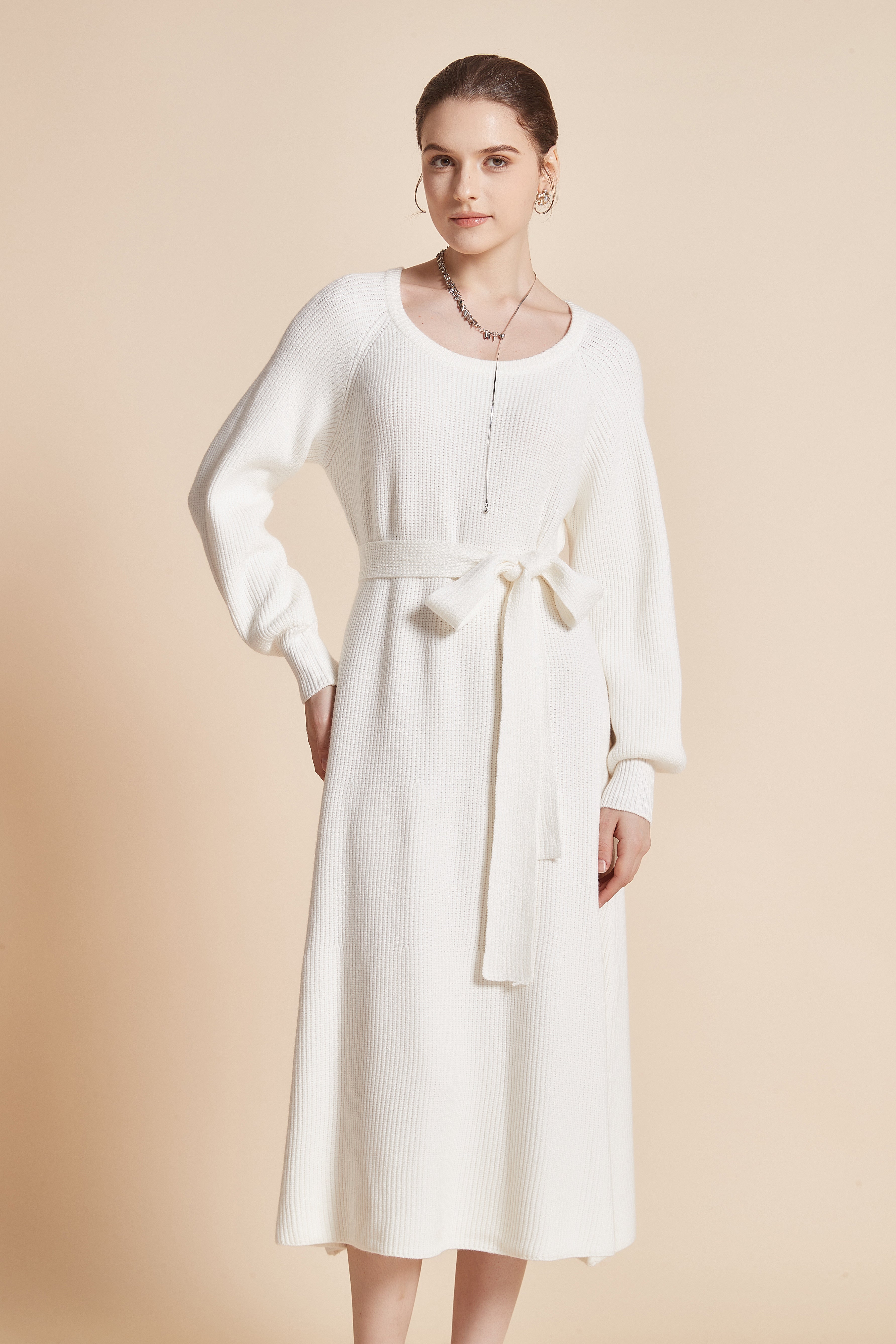 Yola Midi dress with a round neckline, long wide sleeves, and a waist tie