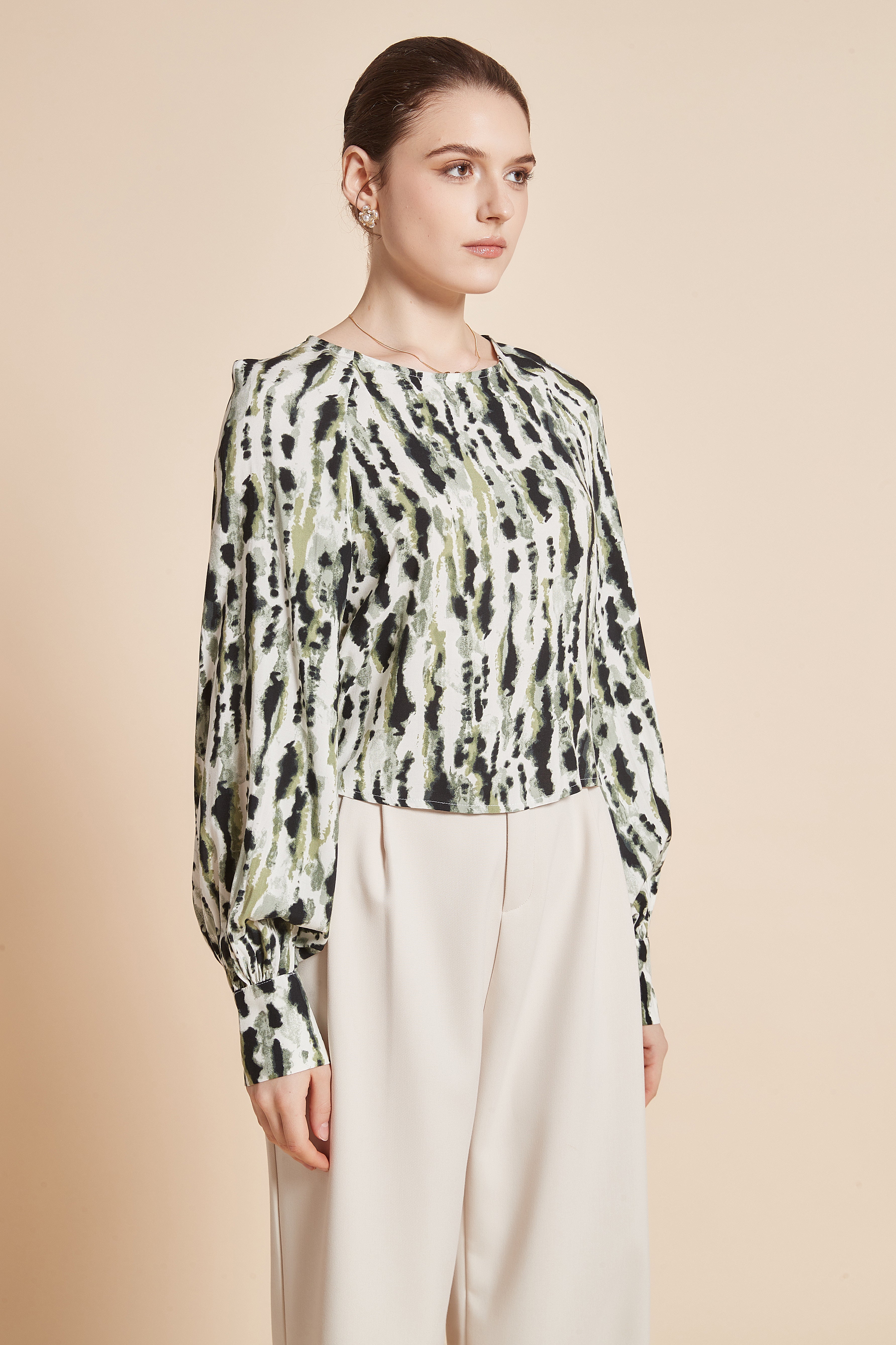 Striped blouse with vertical colors, long wide sleeves, and a round neckline