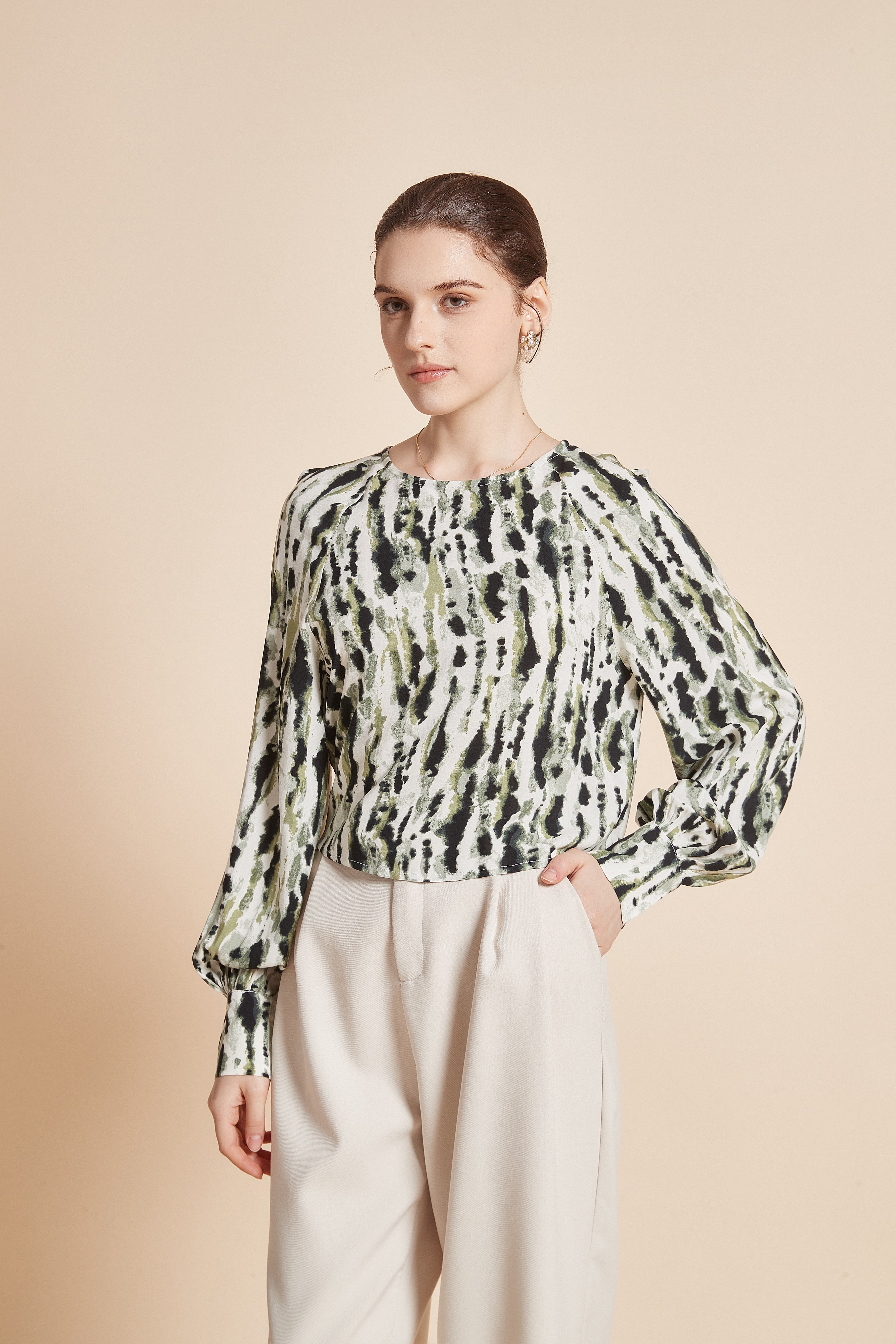 Striped blouse with vertical colors, long wide sleeves, and a round neckline