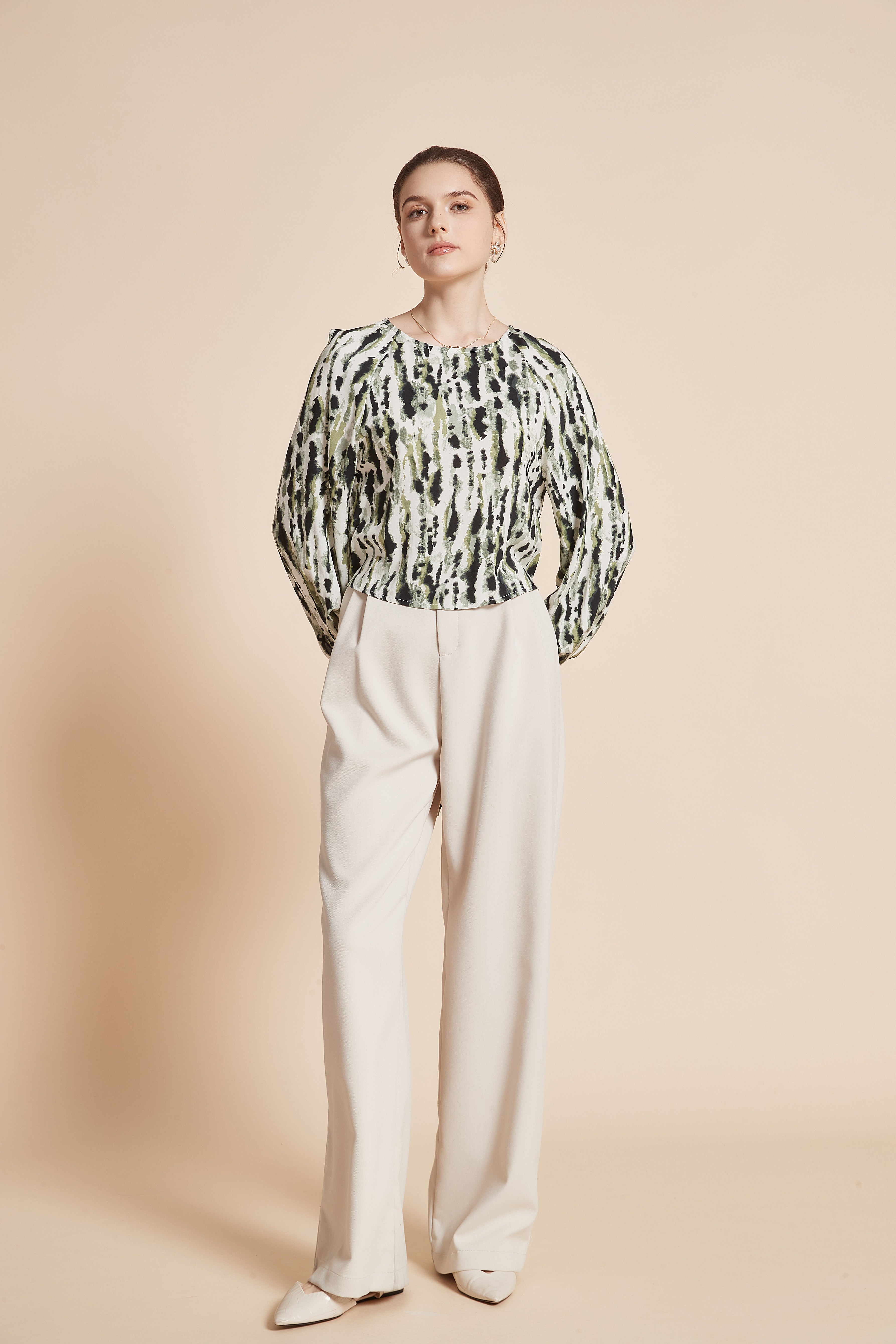 Striped blouse with vertical colors, long wide sleeves, and a round neckline