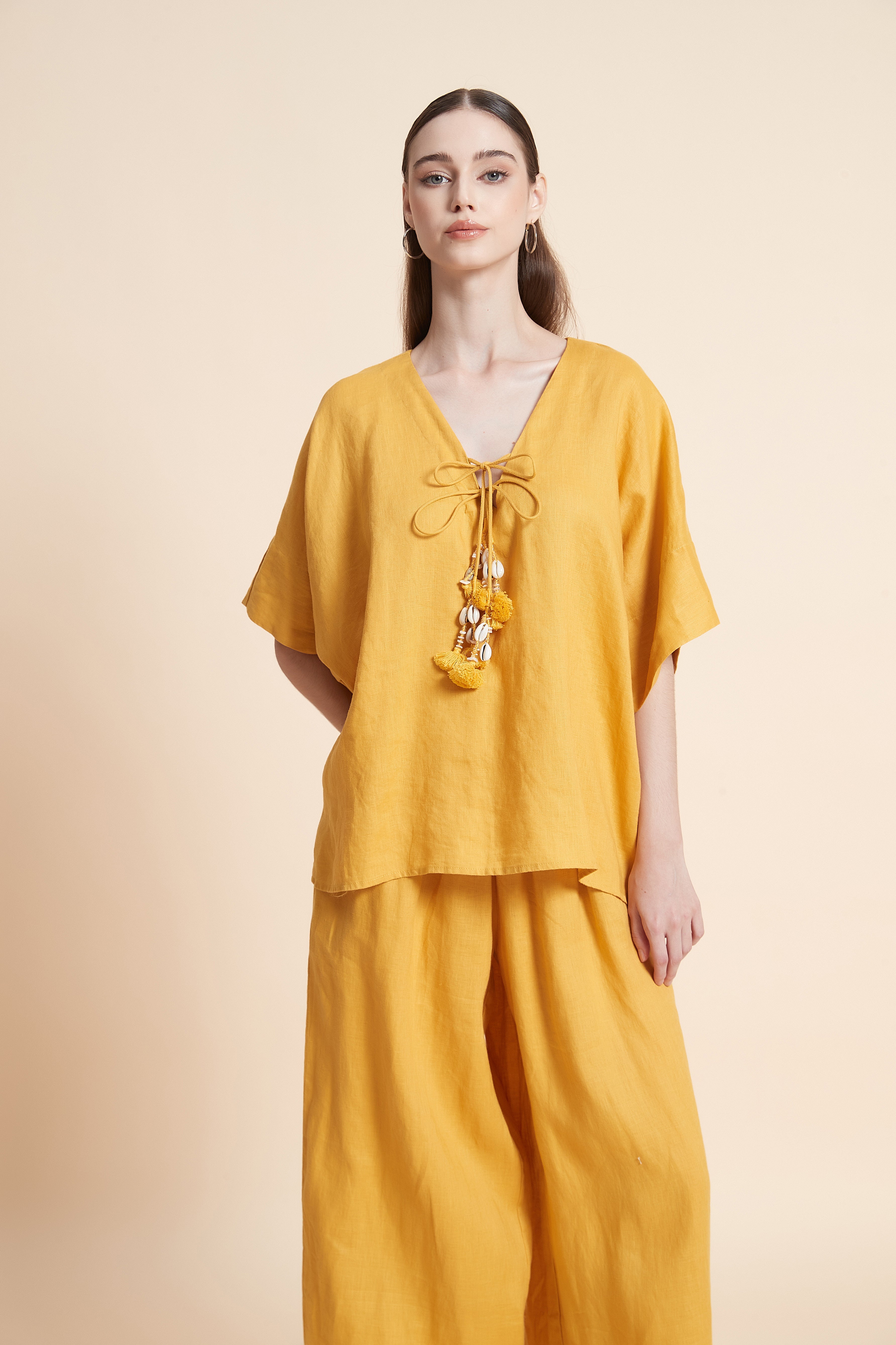Linen blouse with tassel details