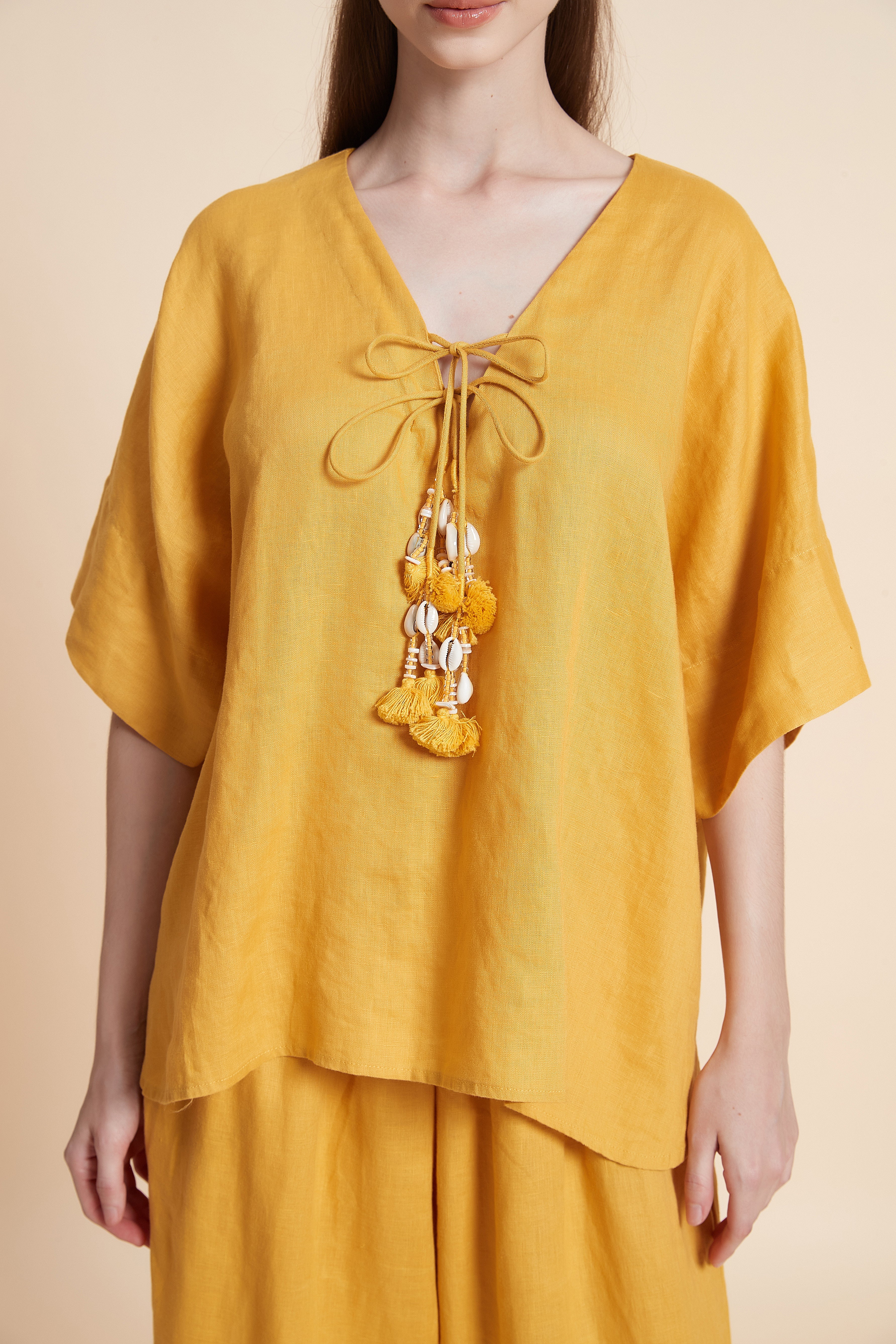 Linen blouse with tassel details