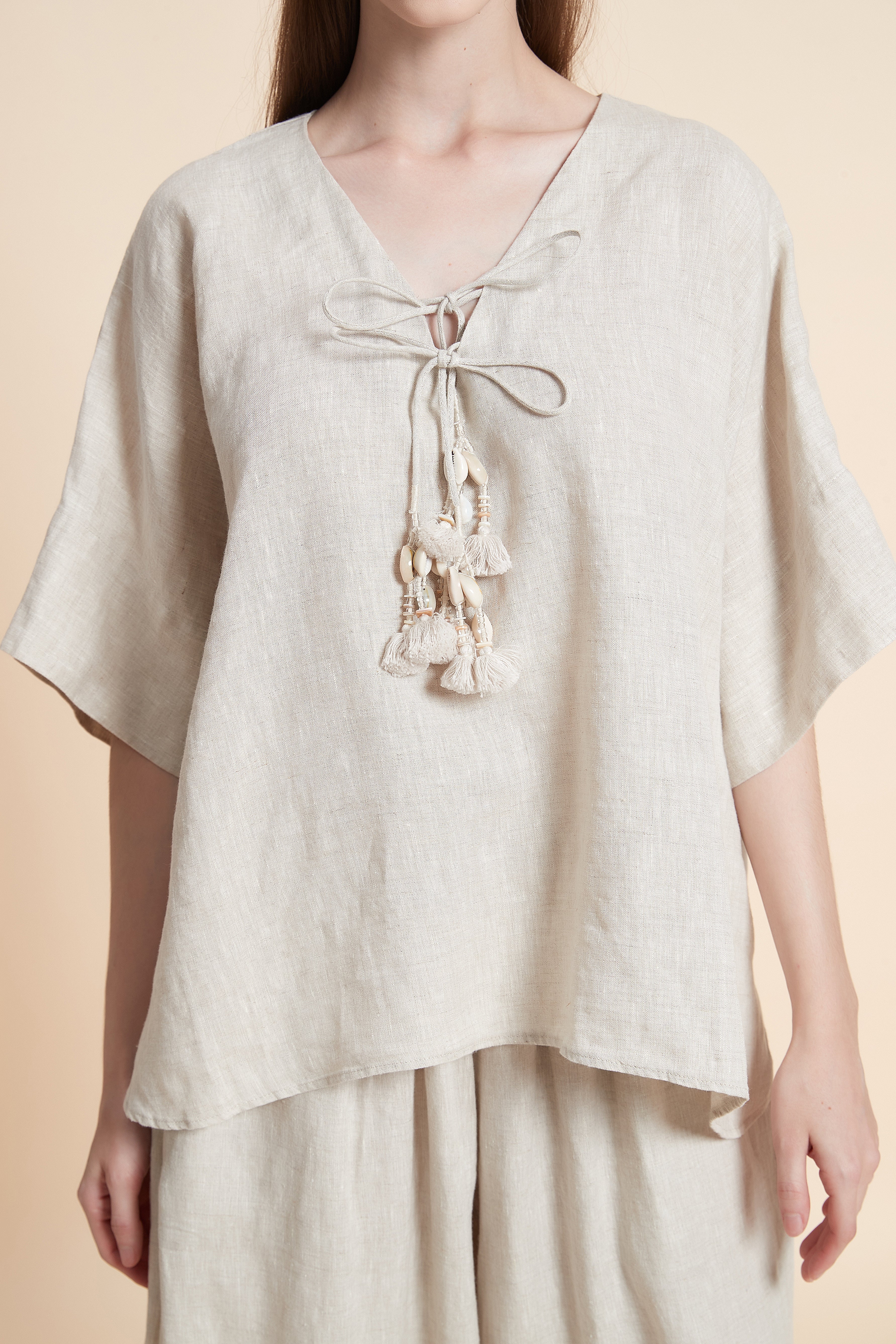 Linen blouse with tassel details