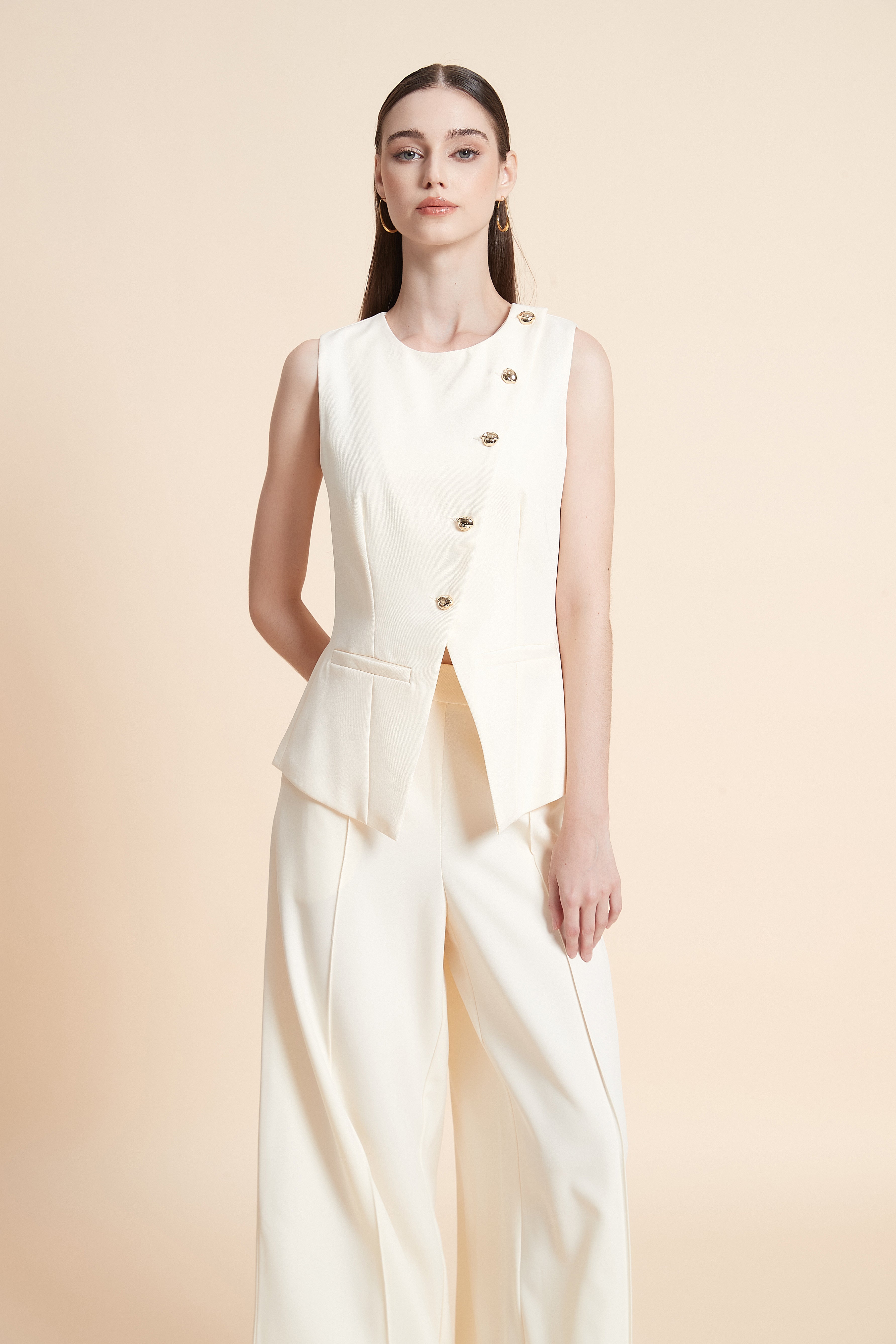 Peplum vest with asymmetrical buttons