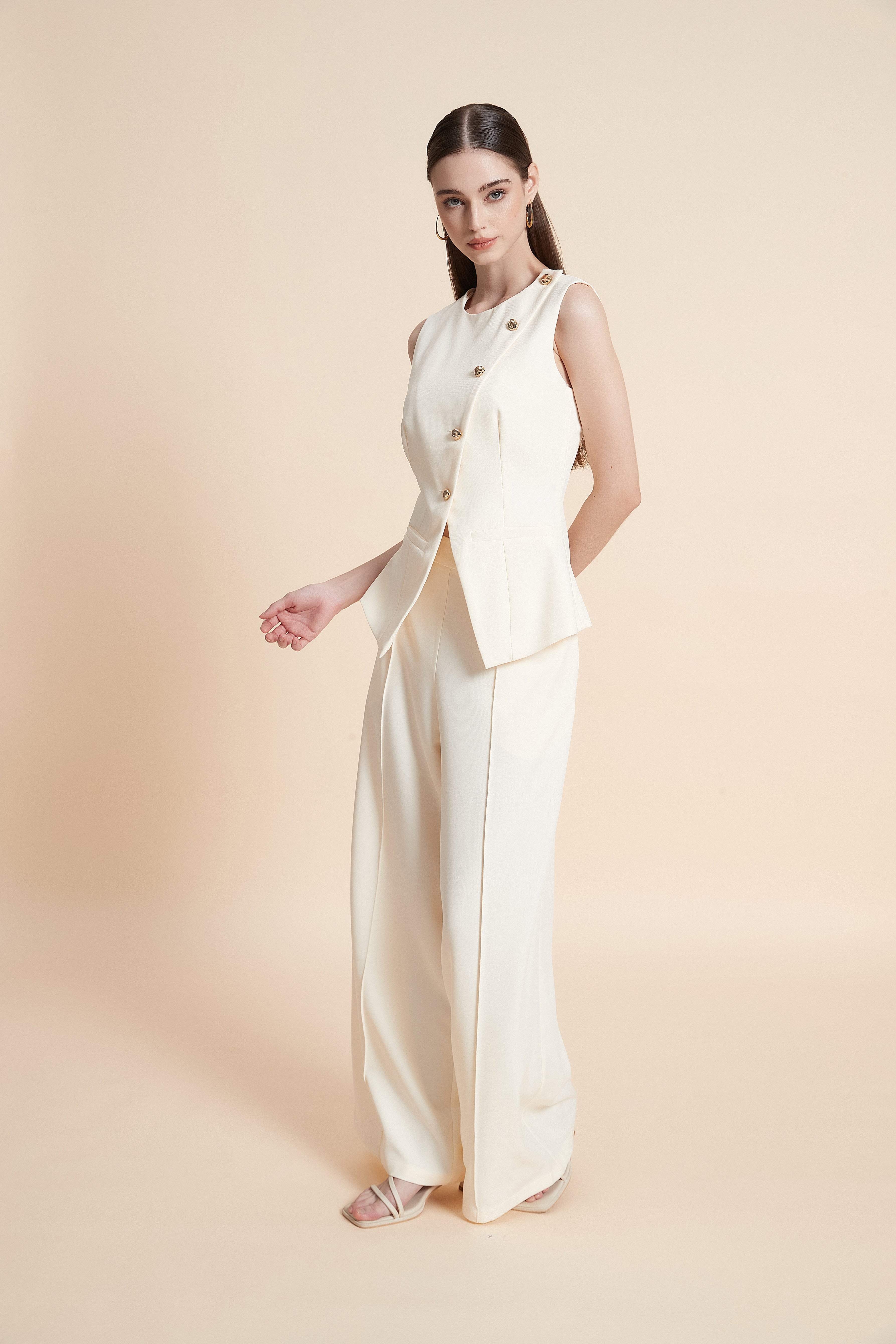 Peplum vest with asymmetrical buttons