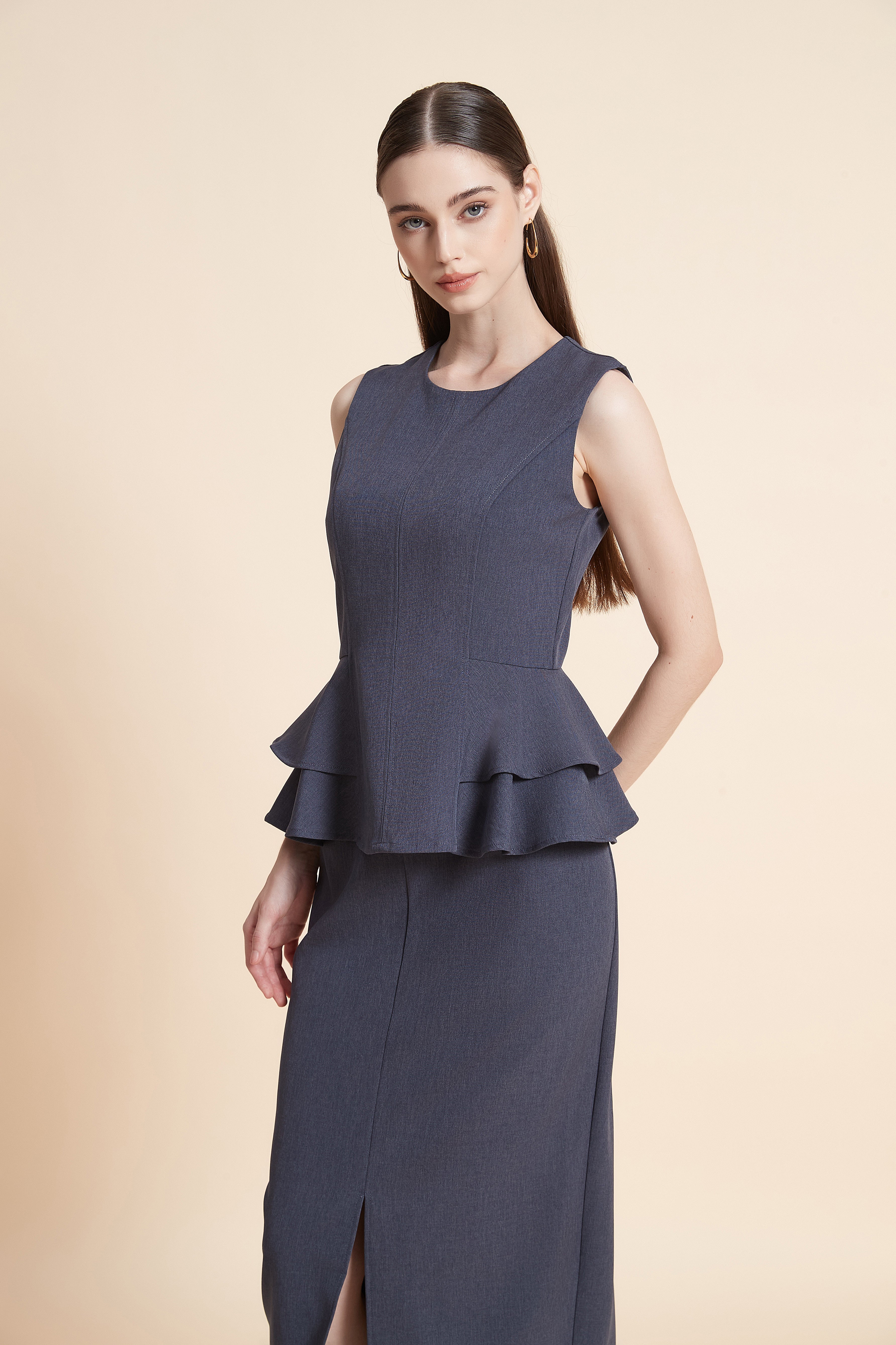 Sleeveless blouse with a cinched waist