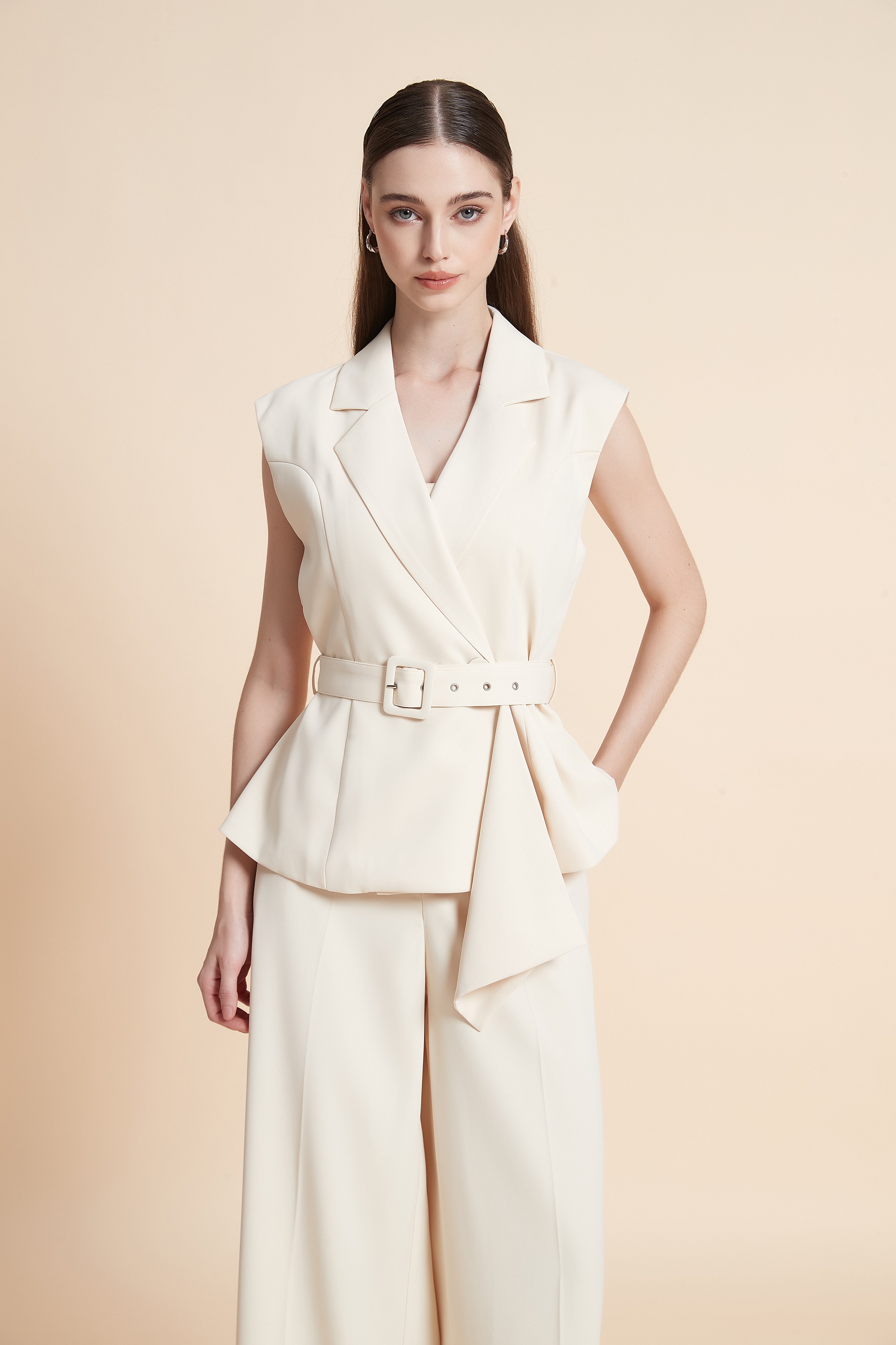Tailored sleeveless vest with a belt