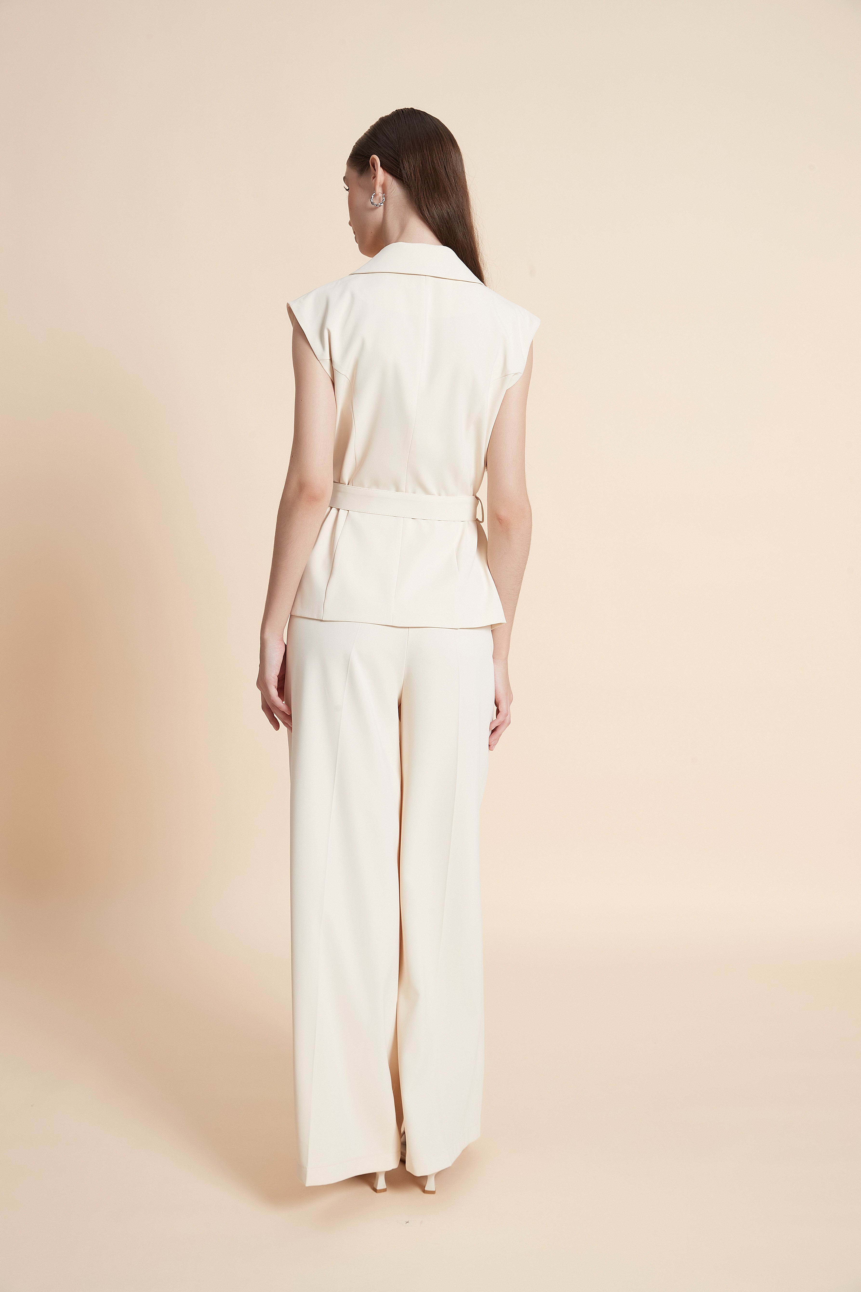 Tailored sleeveless vest with a belt