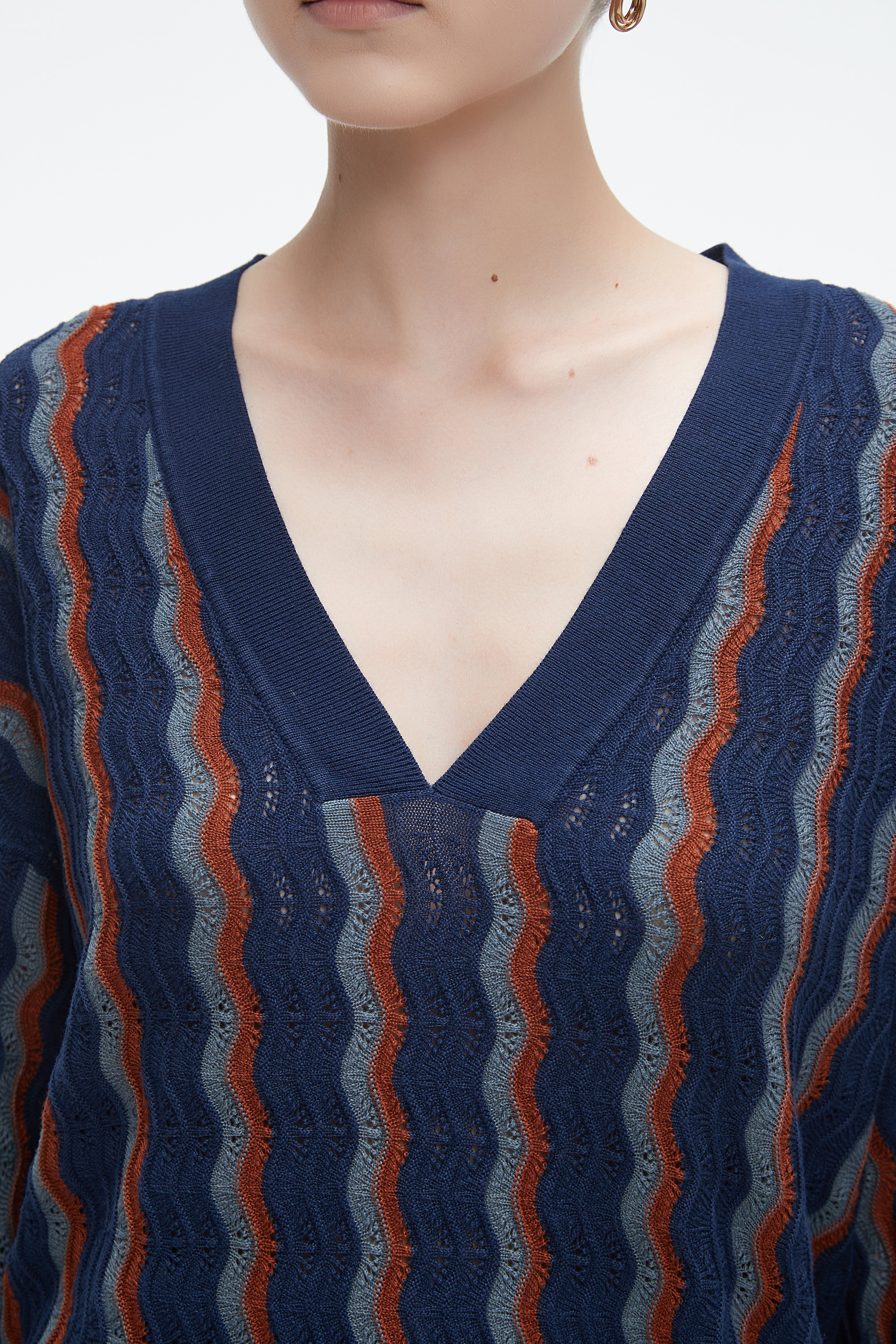 Yola winter blouse with a V-neck, vertically striped