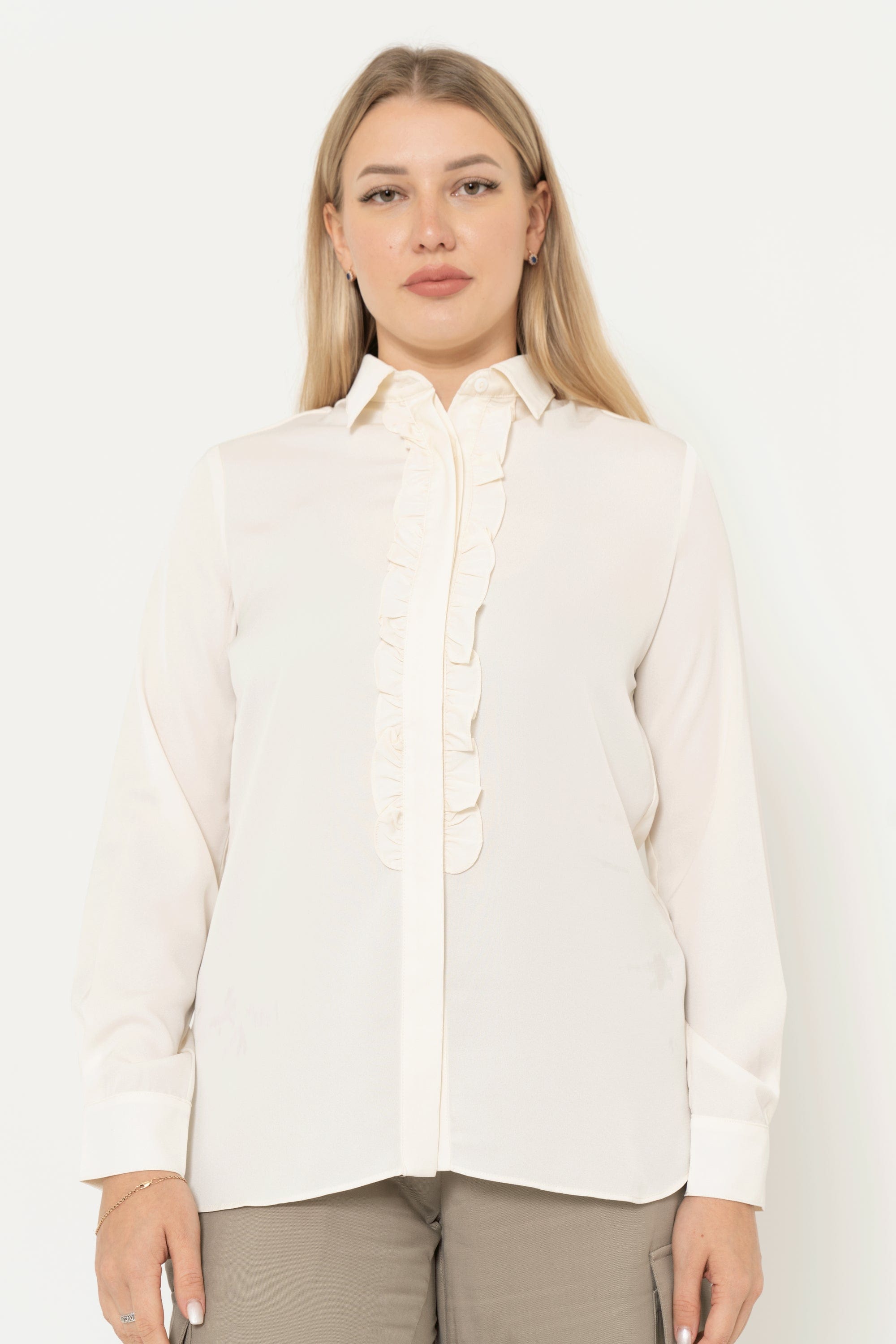 Yola long sleeve solid color blouse with ruffled buttons at the front