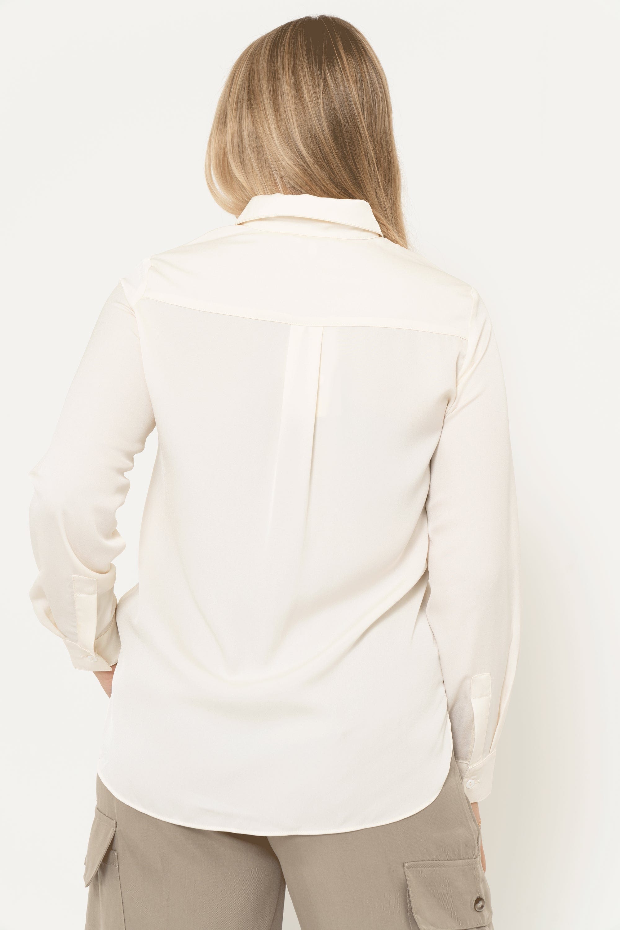 Yola long sleeve solid color blouse with ruffled buttons at the front