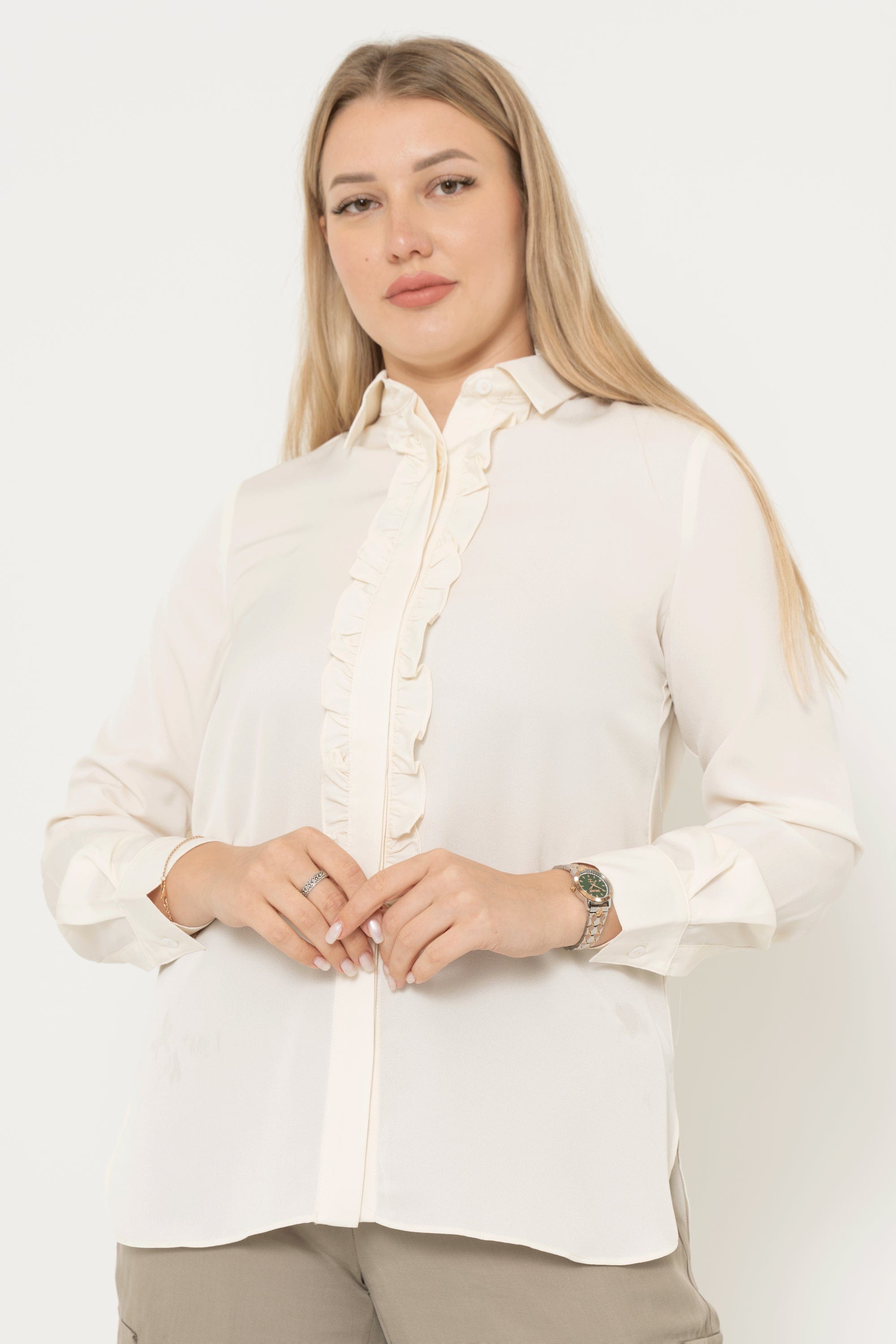 Yola long sleeve solid color blouse with ruffled buttons at the front