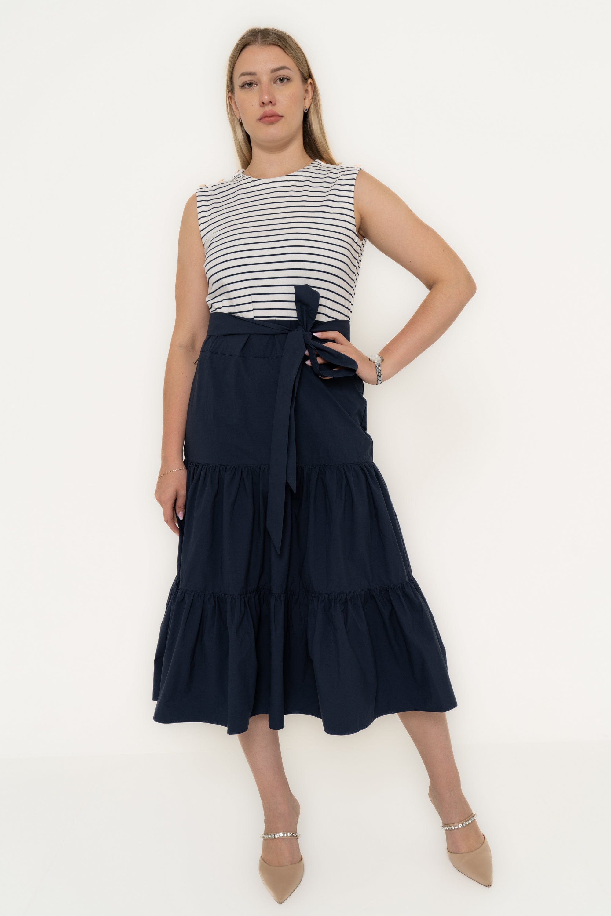 Yola Dress with half horizontal stripes and half solid color, featuring a ruffled design and a tie waist