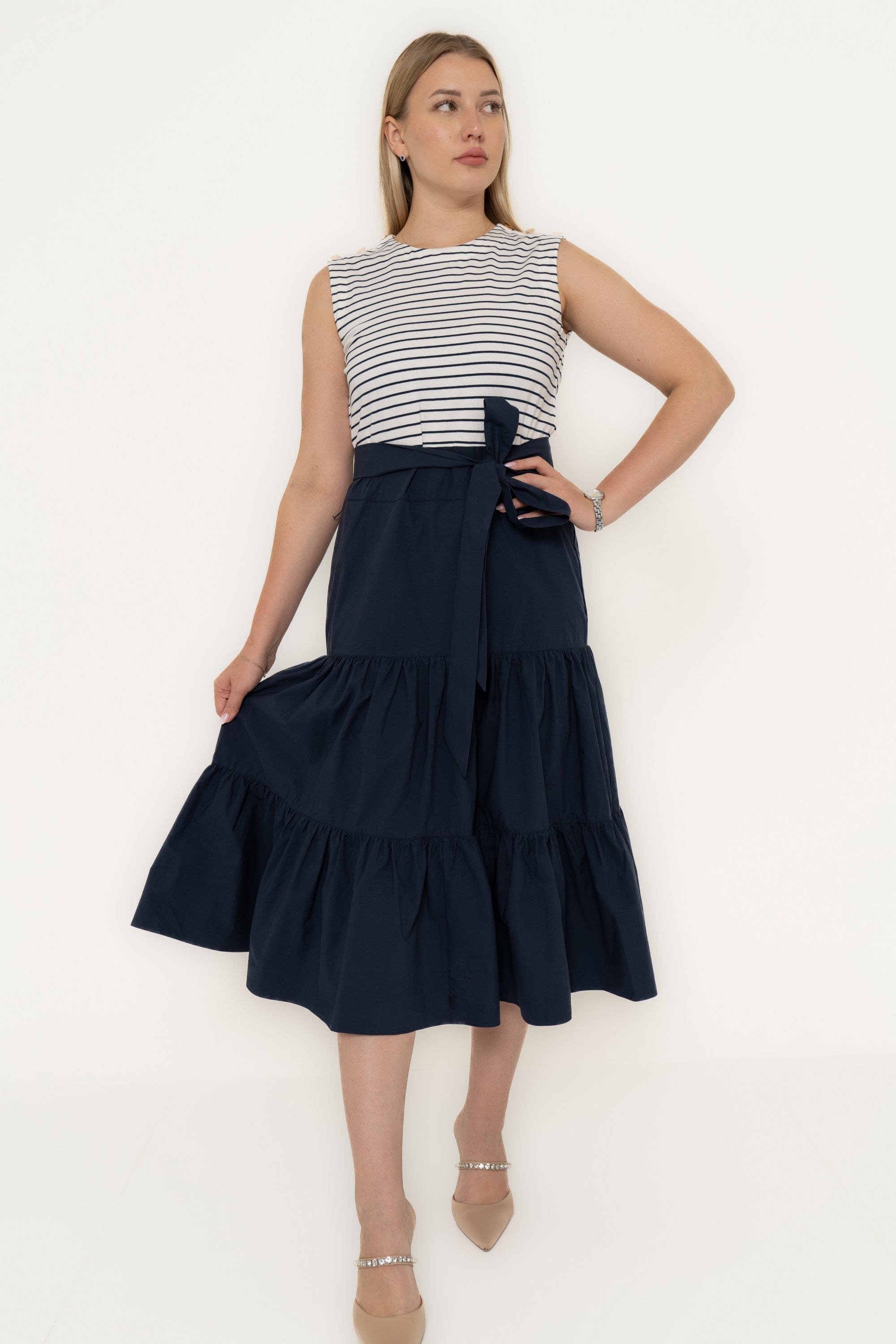 Yola Dress with half horizontal stripes and half solid color, featuring a ruffled design and a tie waist