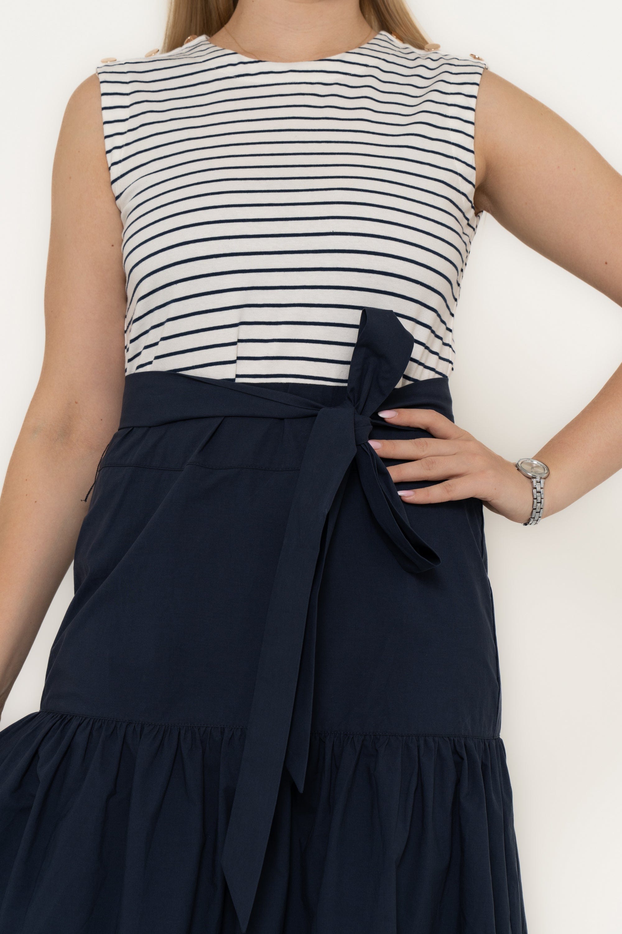 Yola Dress with half horizontal stripes and half solid color, featuring a ruffled design and a tie waist